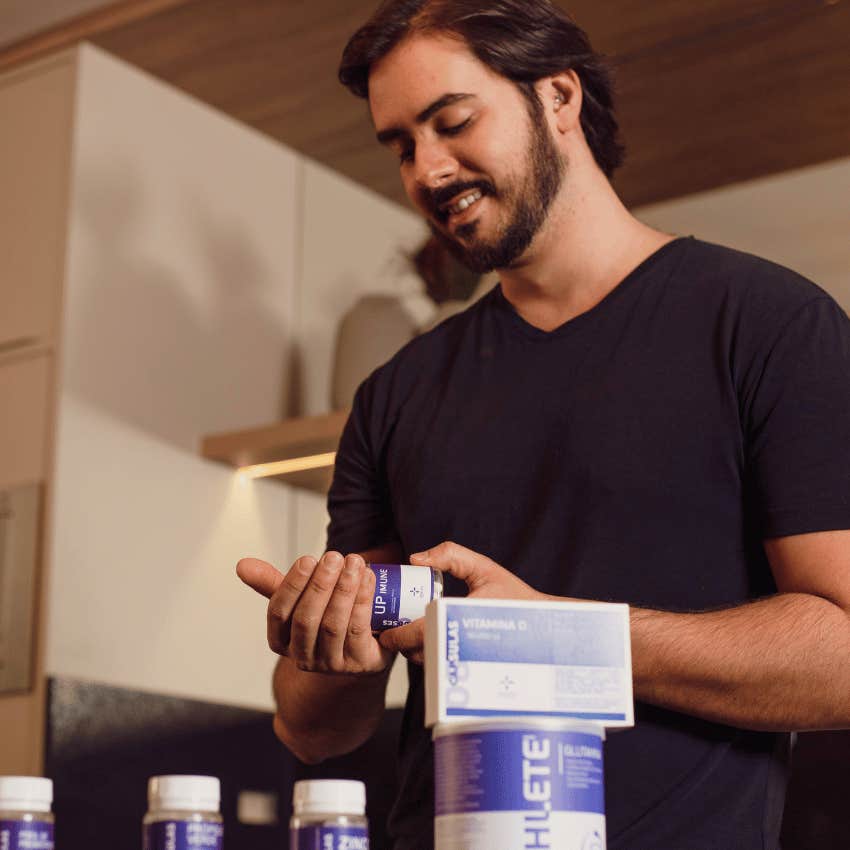man taking supplements because of pressure of male insecurity