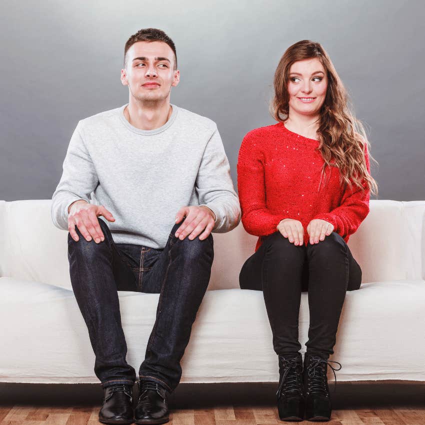 man and woman sitting next to each other wonder who's more emotional
