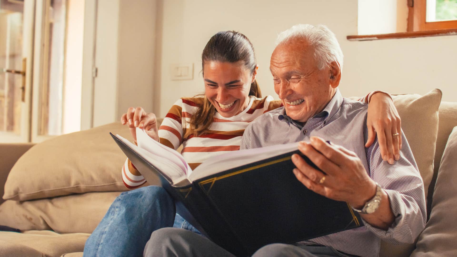 grandpa sharing family history with granddaughter
