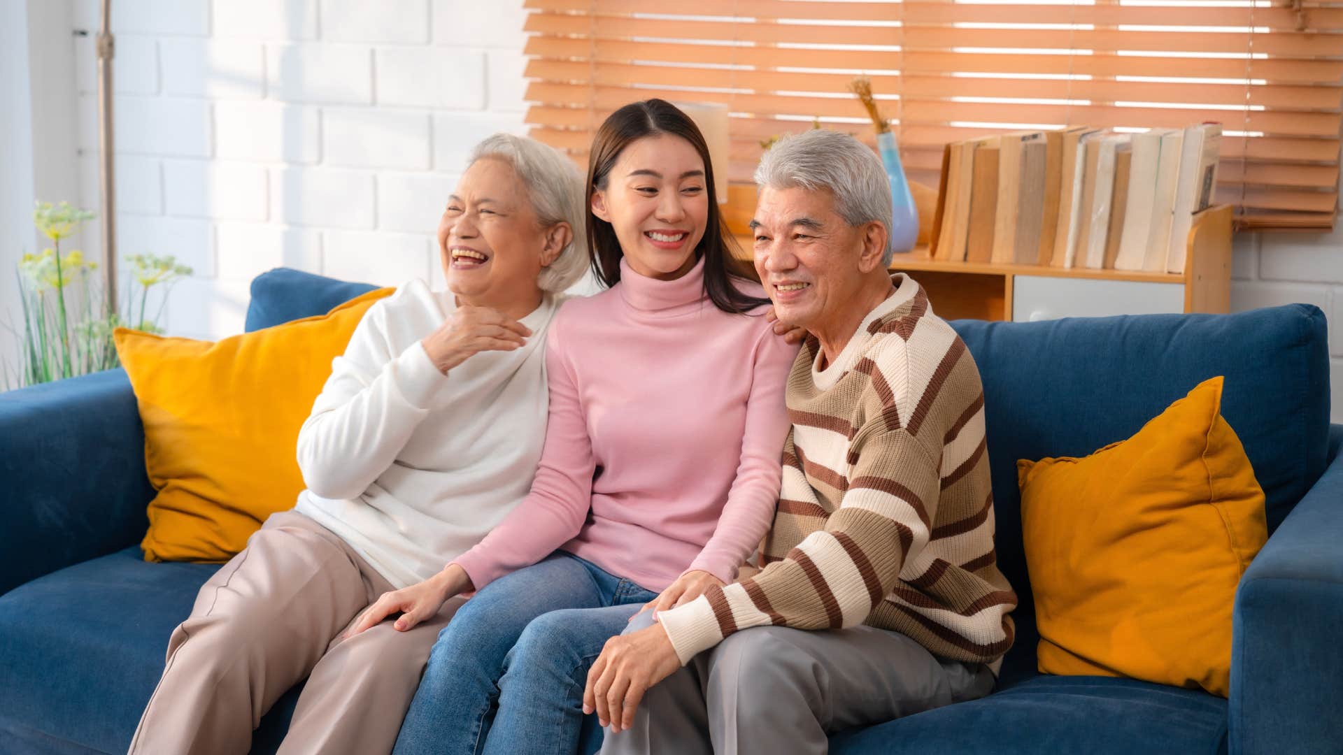 grandparents enjoying time with their adult granddaughter