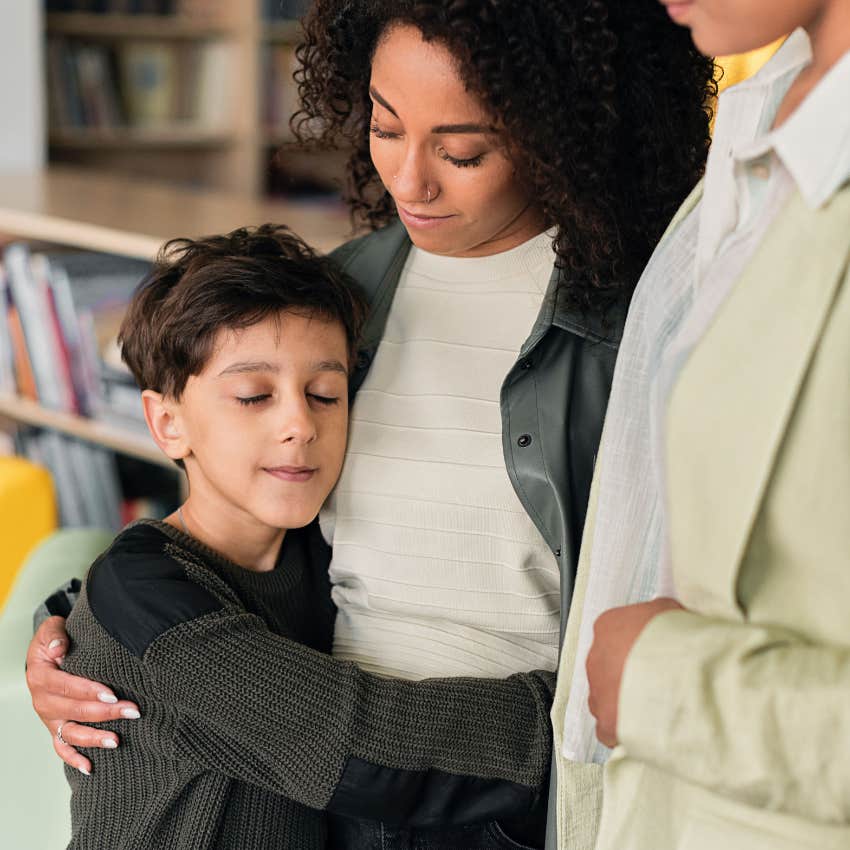 moms hugging son showing him acts of kindness