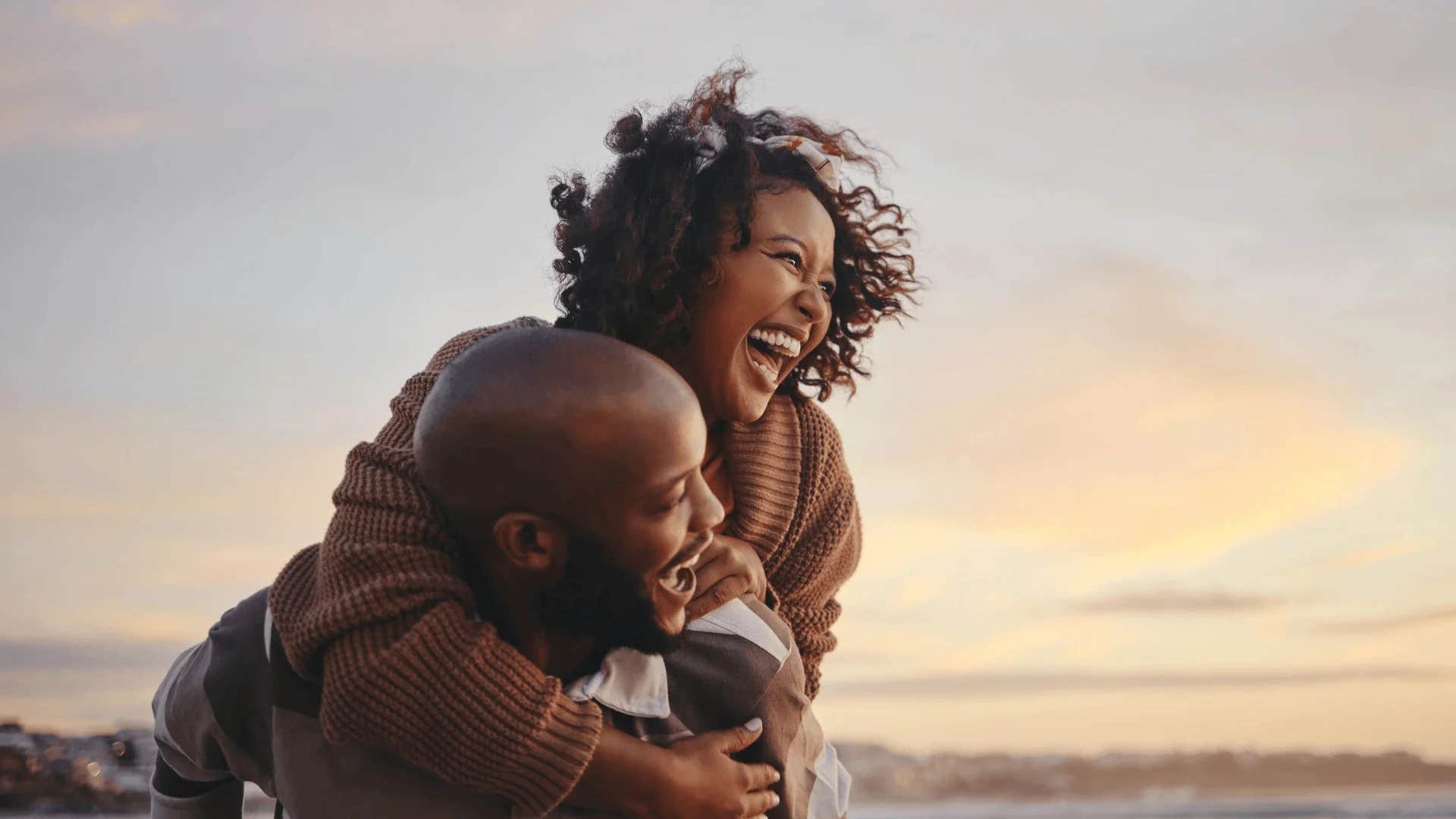 man carrying happy woman telling her i can't stop thinking of you