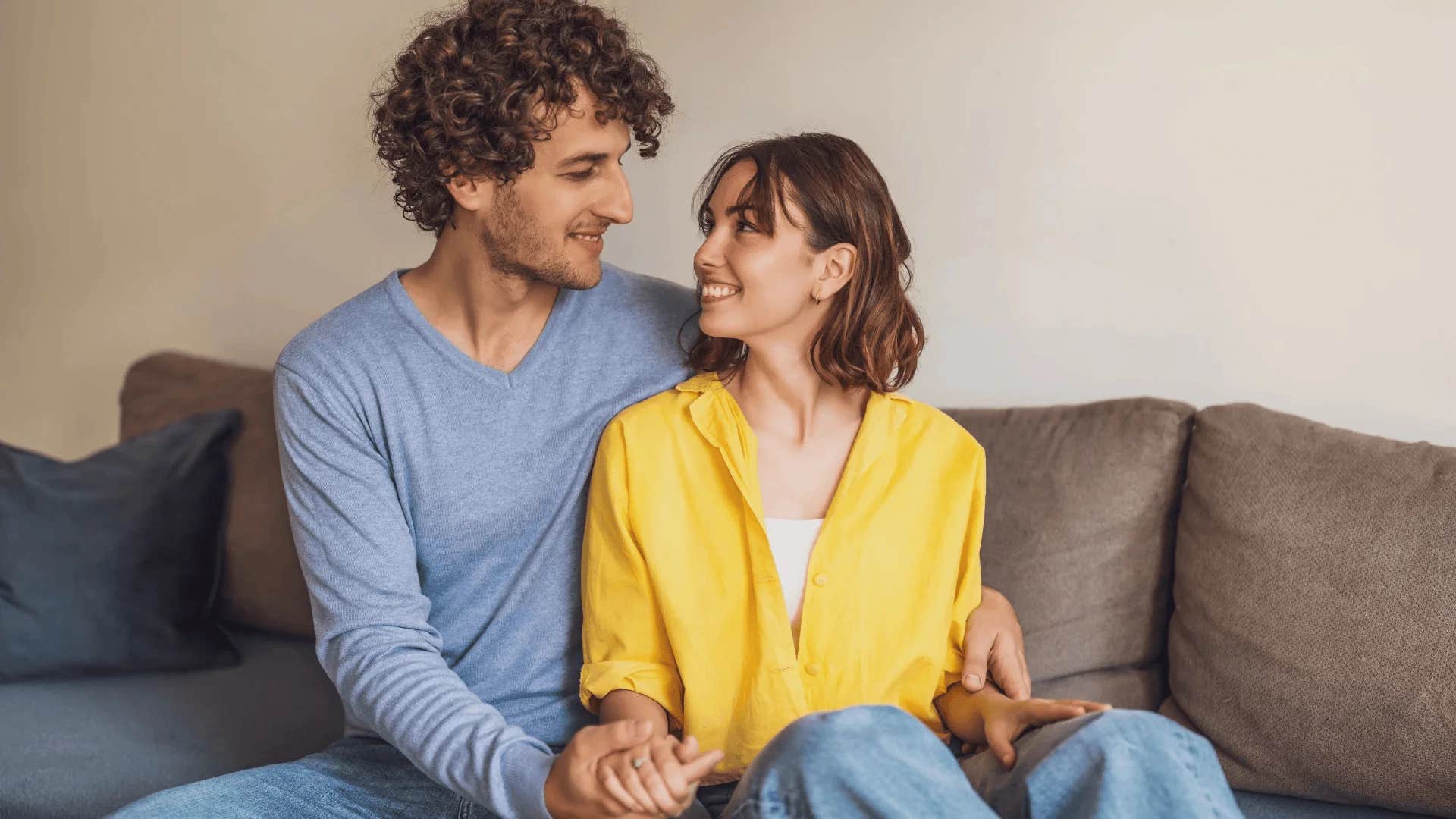 man playfully telling woman stop being so cute