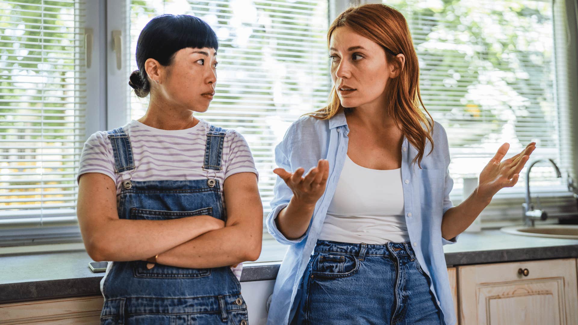 woman with blonde hair telling friend i don't need to explain myself