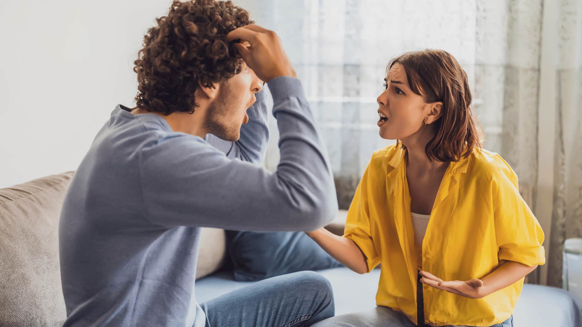 woman screaming at man and telling him you made me act this way