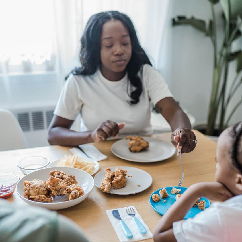 mom trying to have a family meal with kids