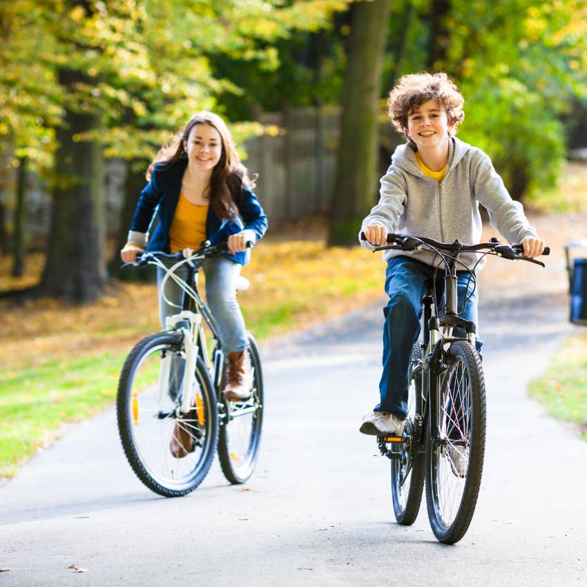 kids riding their bikes in the neighborhood getting home before dark