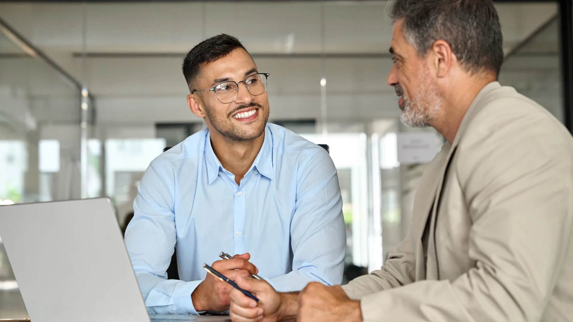 man smiling at colleague who doesn't want to be friends