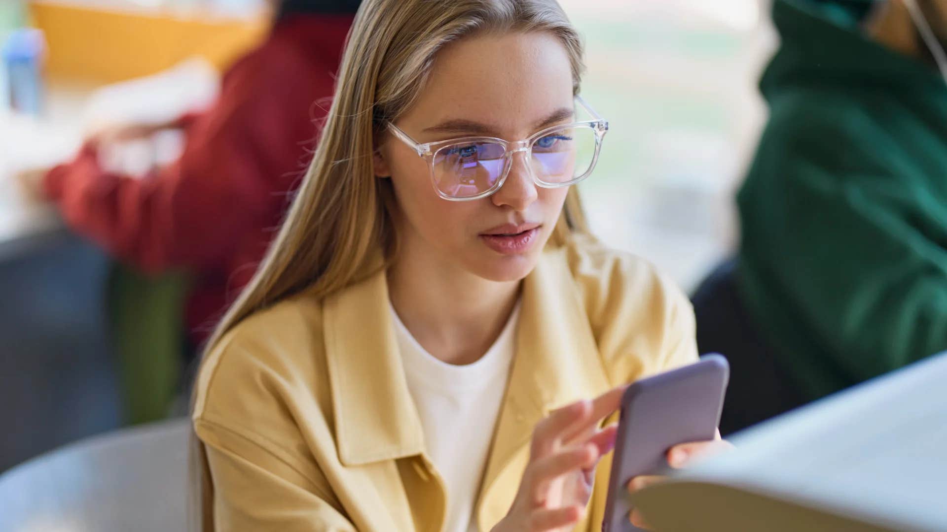 woman on her phone not wanting to work outside of her normal hours