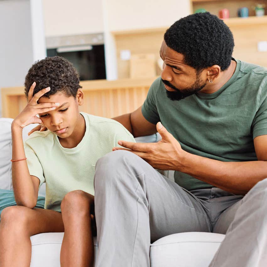 parent encouraging young boy to try again