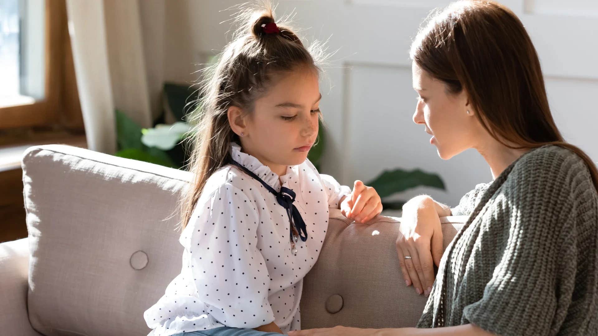 woman scolding young girl saying don't ask for more be grateful