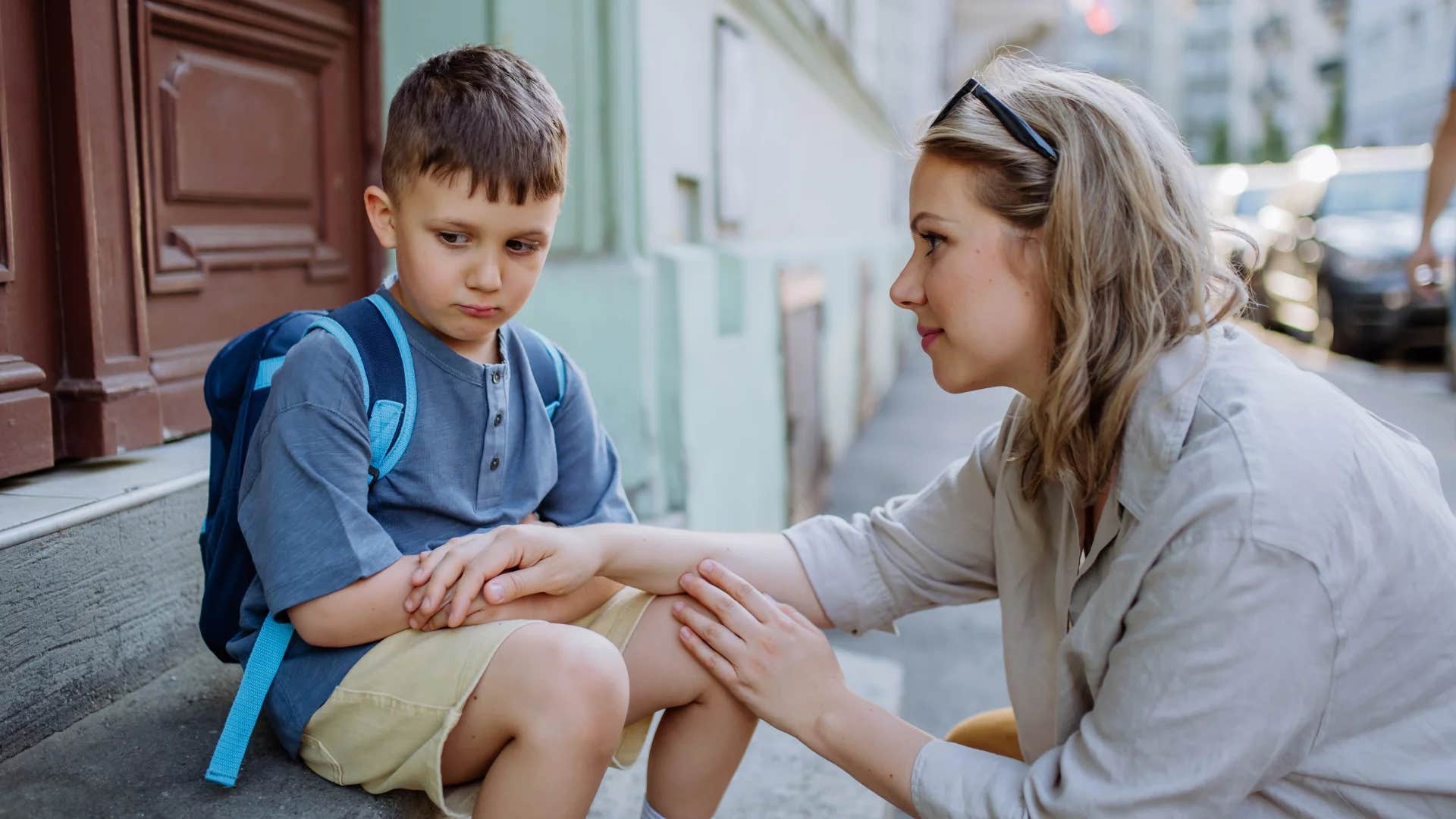 woman telling upset child i'm proud of you