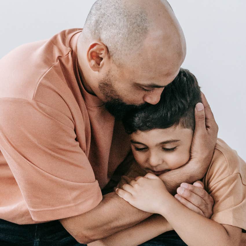 father comforting his scared son instead of dismissing his worries