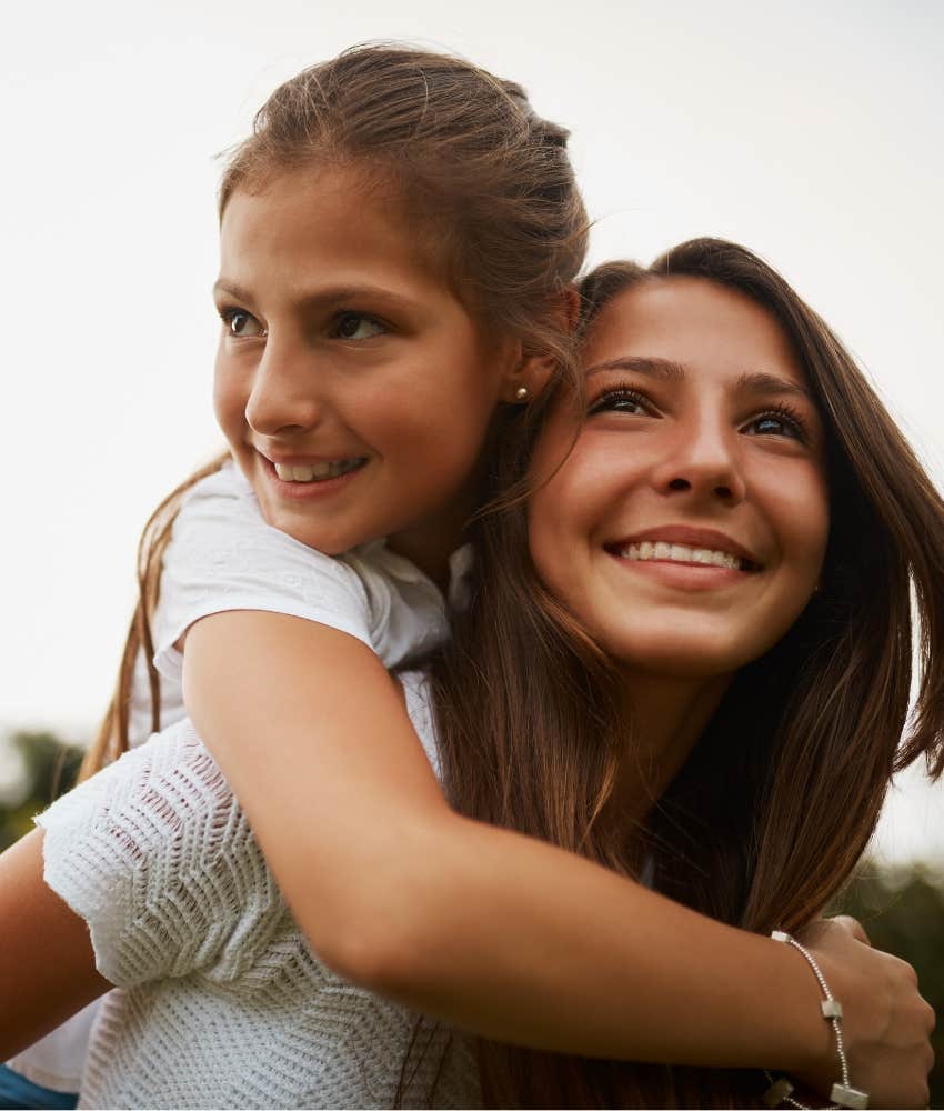 Kids who are deeply happy doing a piggy back ride happily