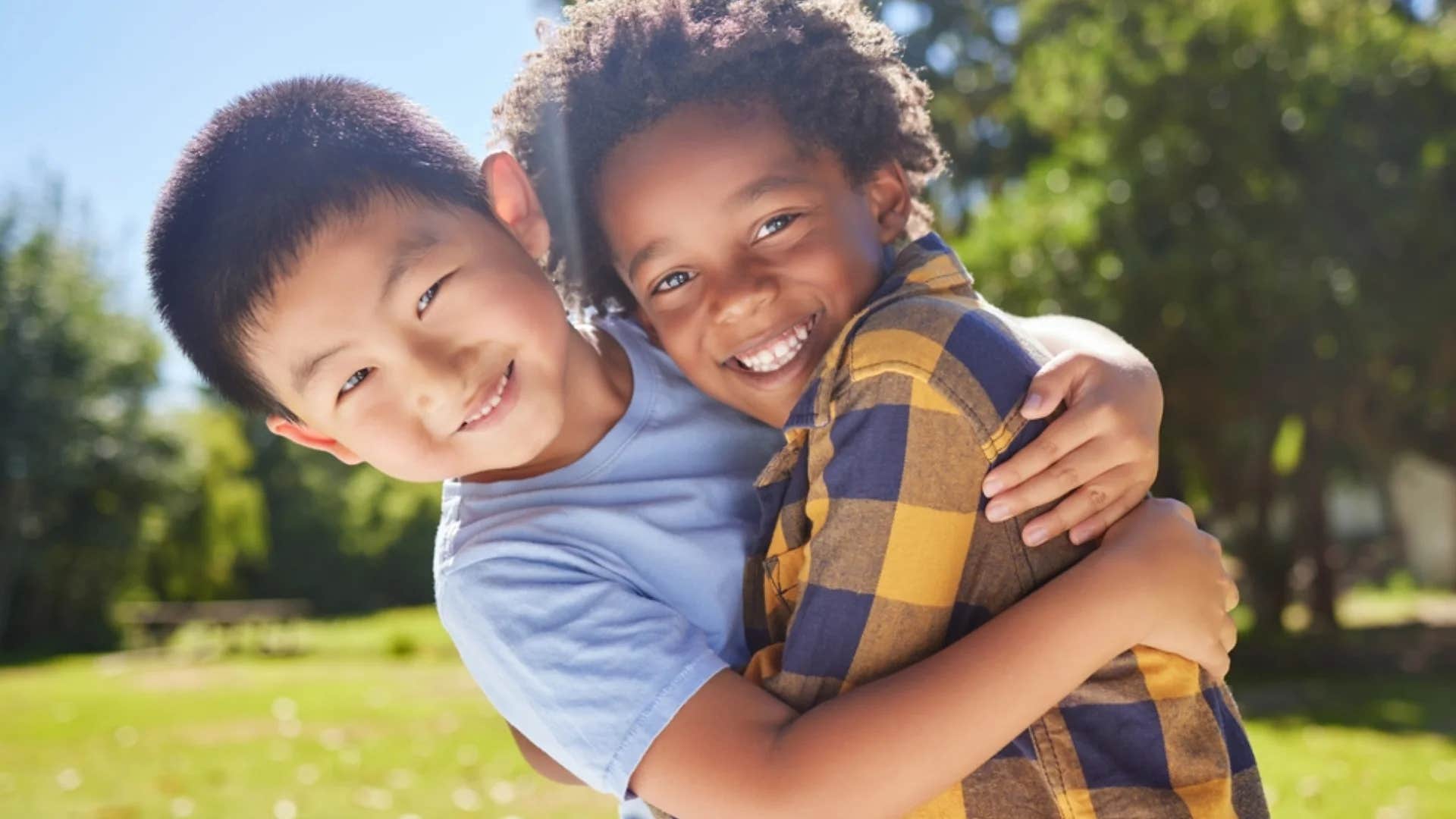 two little boys with a strong friendship hugging