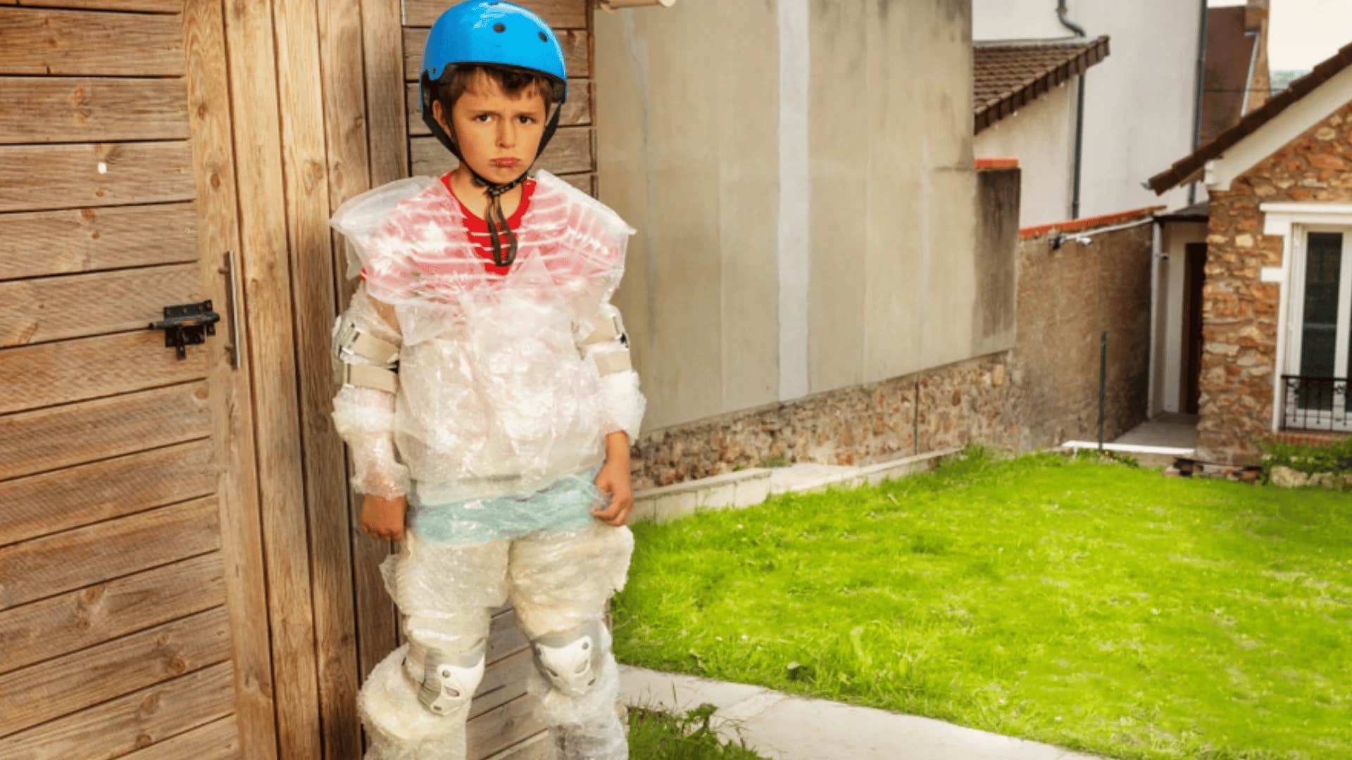 overprotective little boy wrapped in bubble wrap to protect him