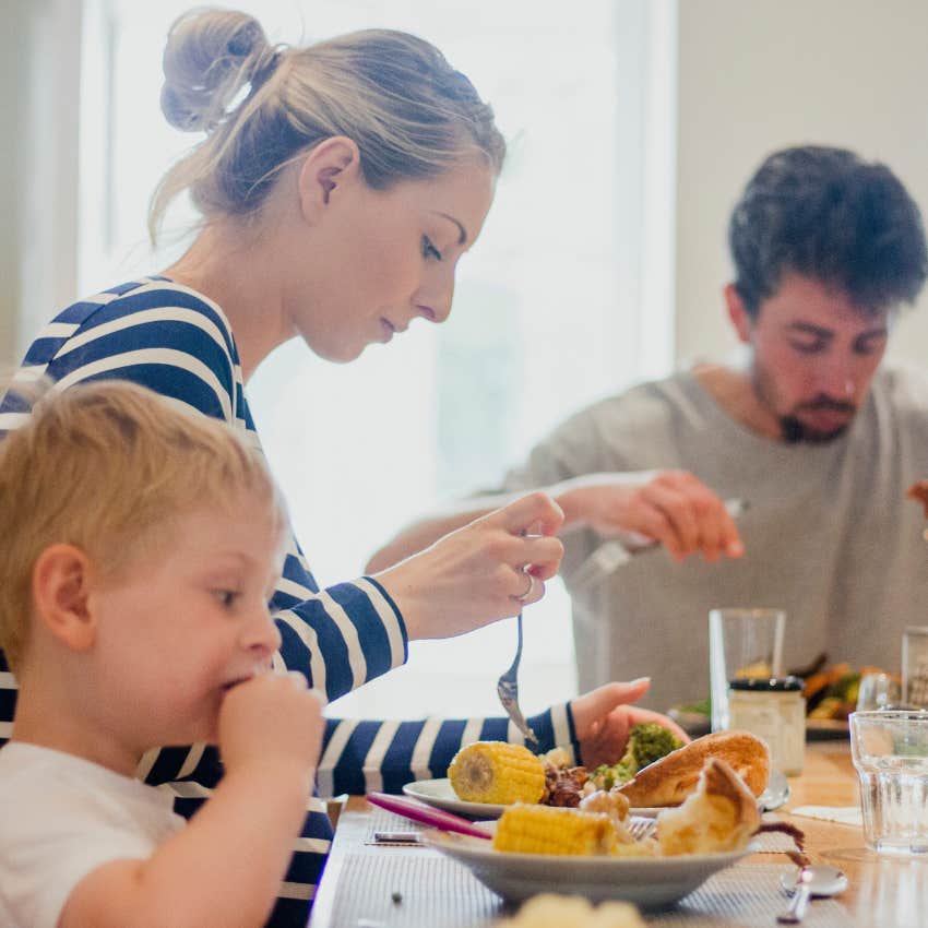parents teaching their kids good manners by playing restaurant at home
