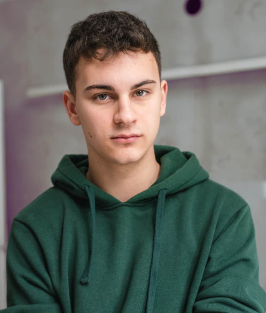 passive-aggressive young man who avoid giving a straight answer looms at camera