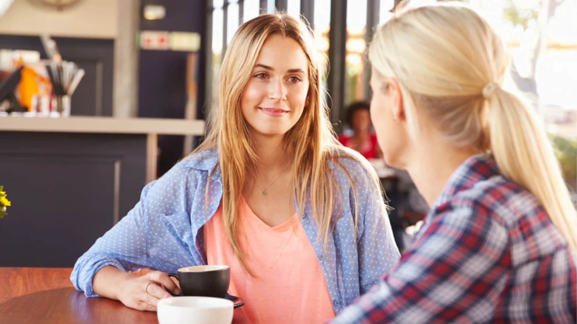 woman secretly judging friend saying good for you