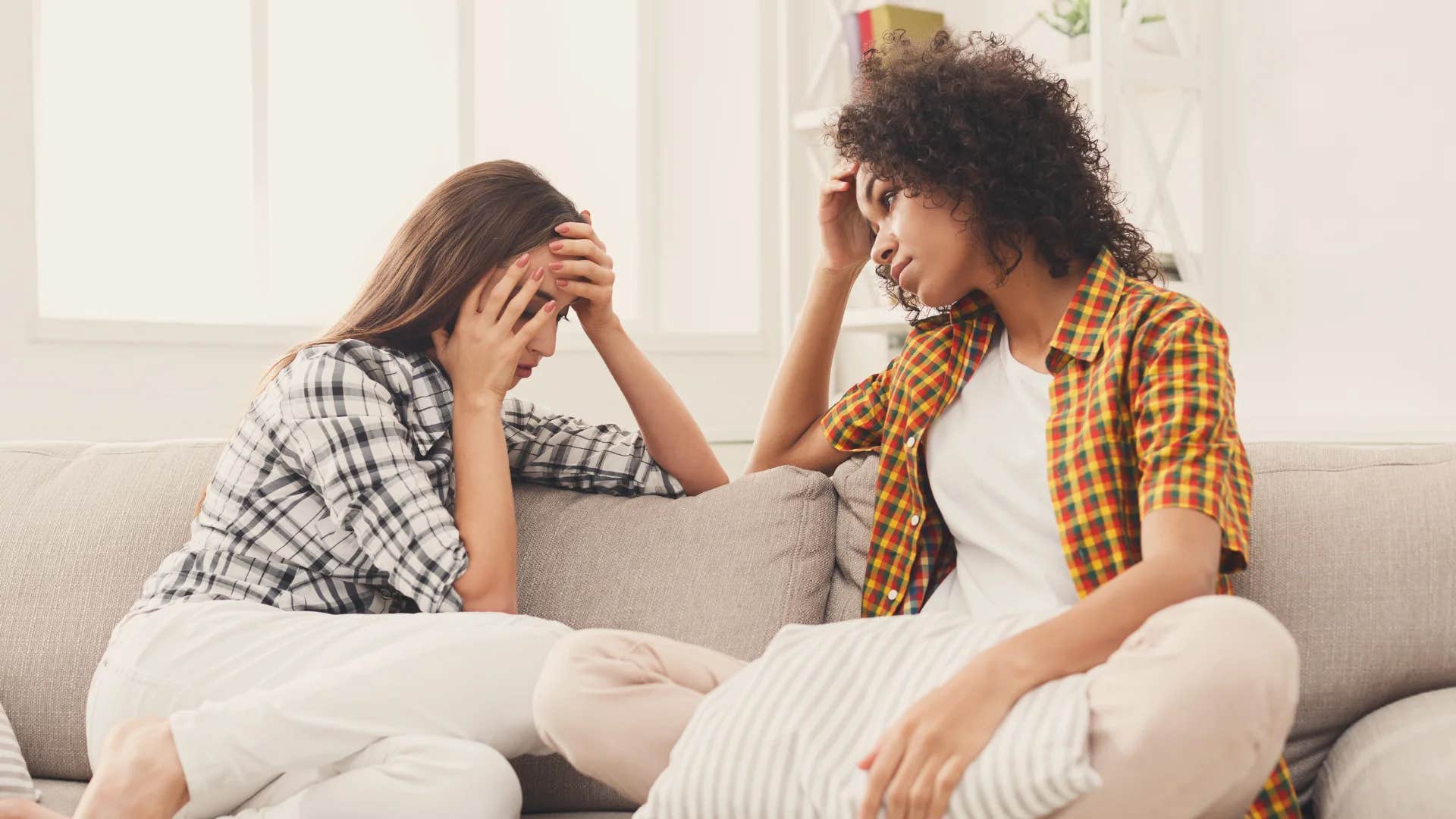 woman asking her friend what's going on