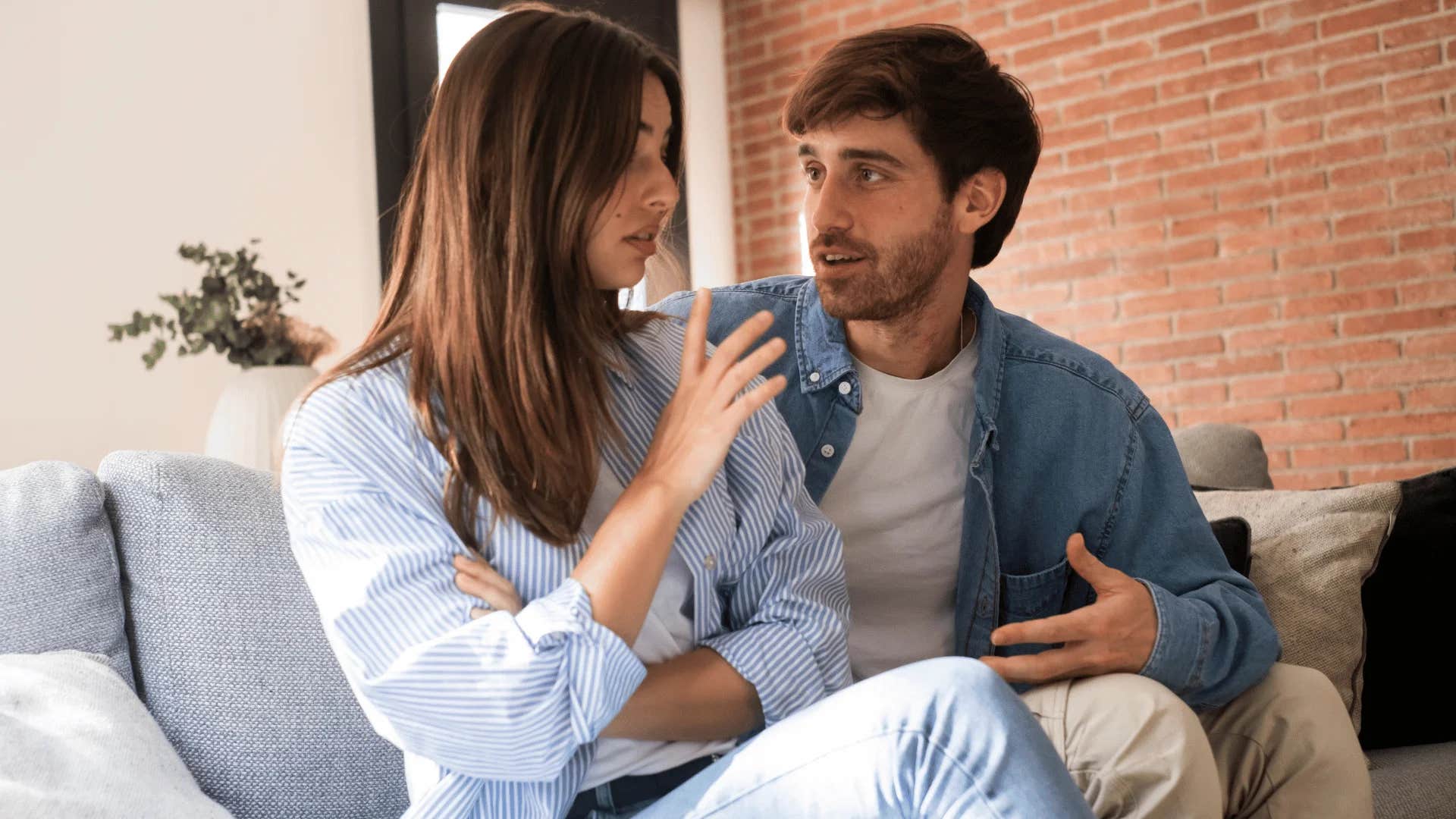 woman telling man for now let's take a step back from this conversation
