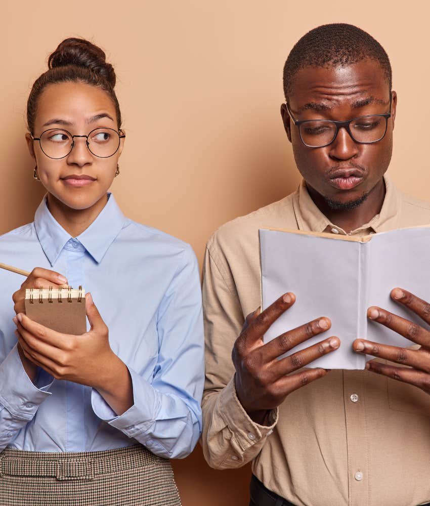 Woman looking at a man and taking notes of patterns 