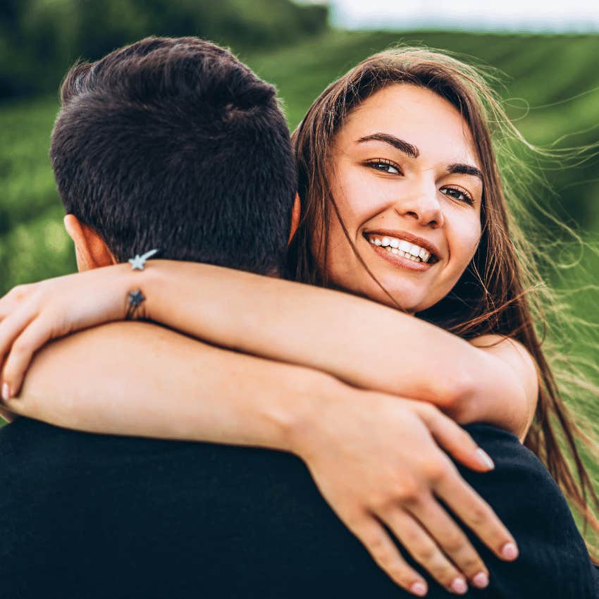 woman hugging man saying i adore you