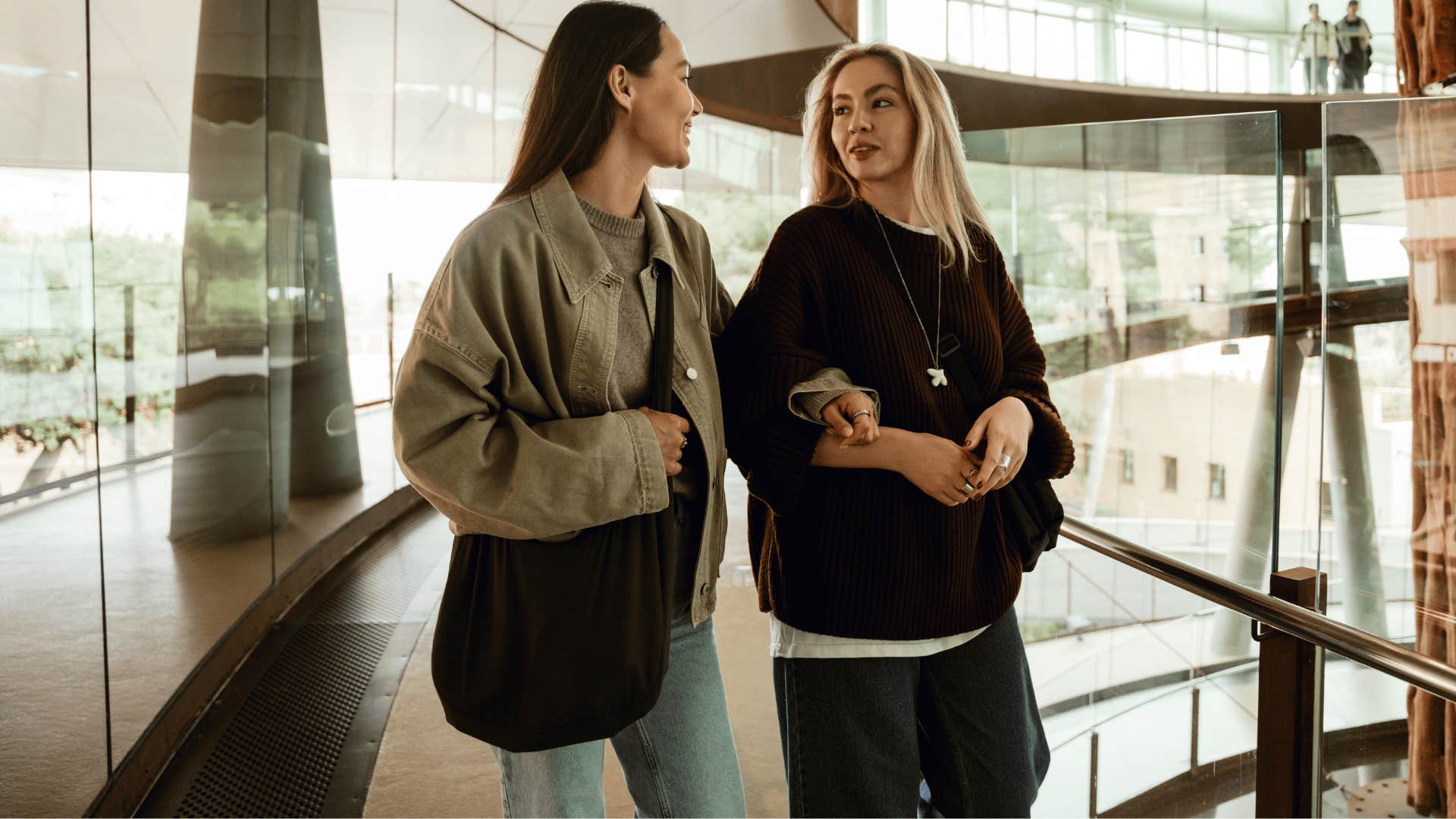 friends chatting and walking as woman with blonde hair says that's not really my thing