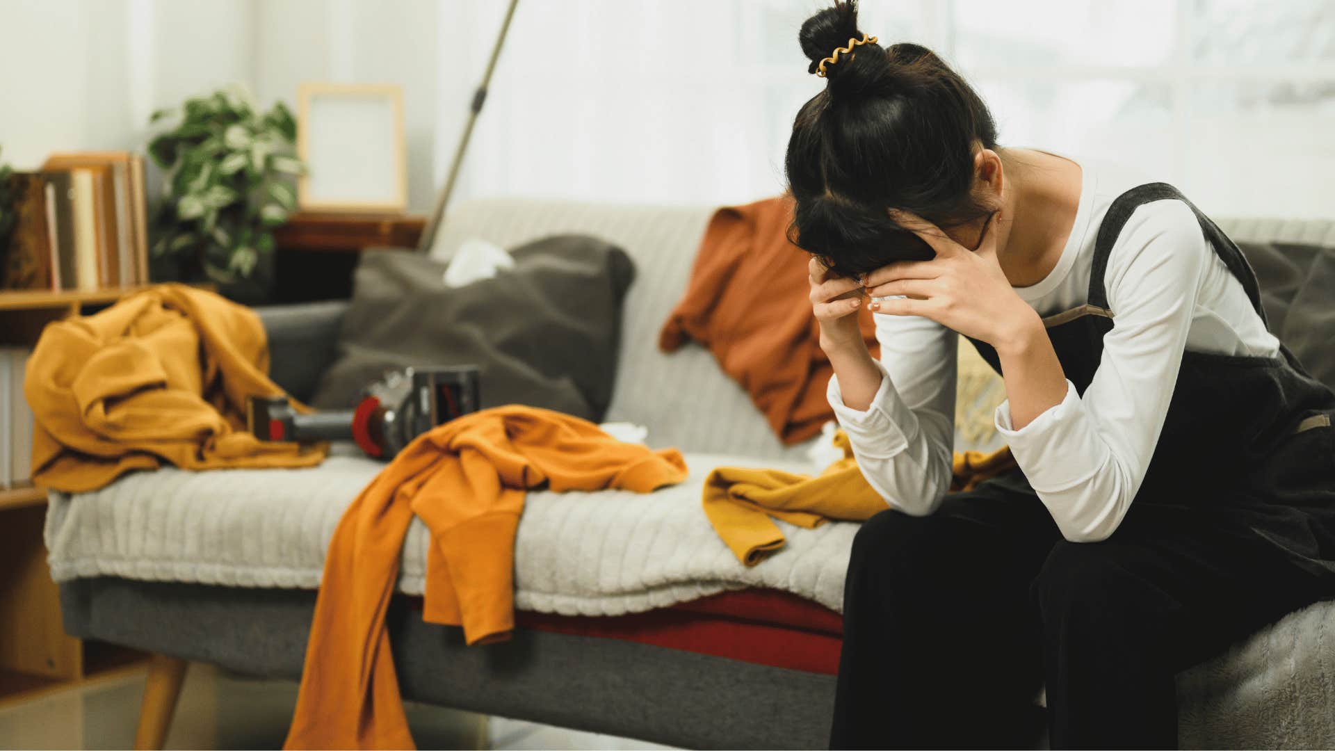 woman upset at messy house as she thinks it's usually not this bad