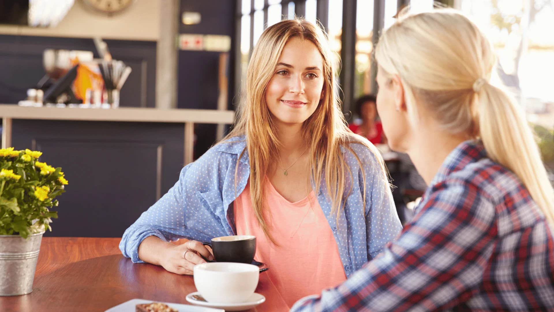 woman talking to friend suggesting let's look at both sides