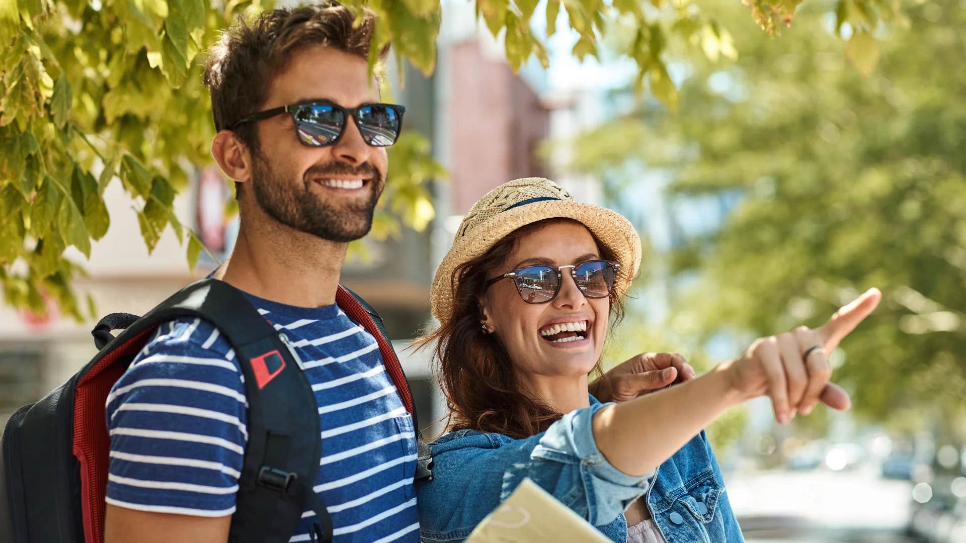 woman pointing telling man we parked kitty-corner