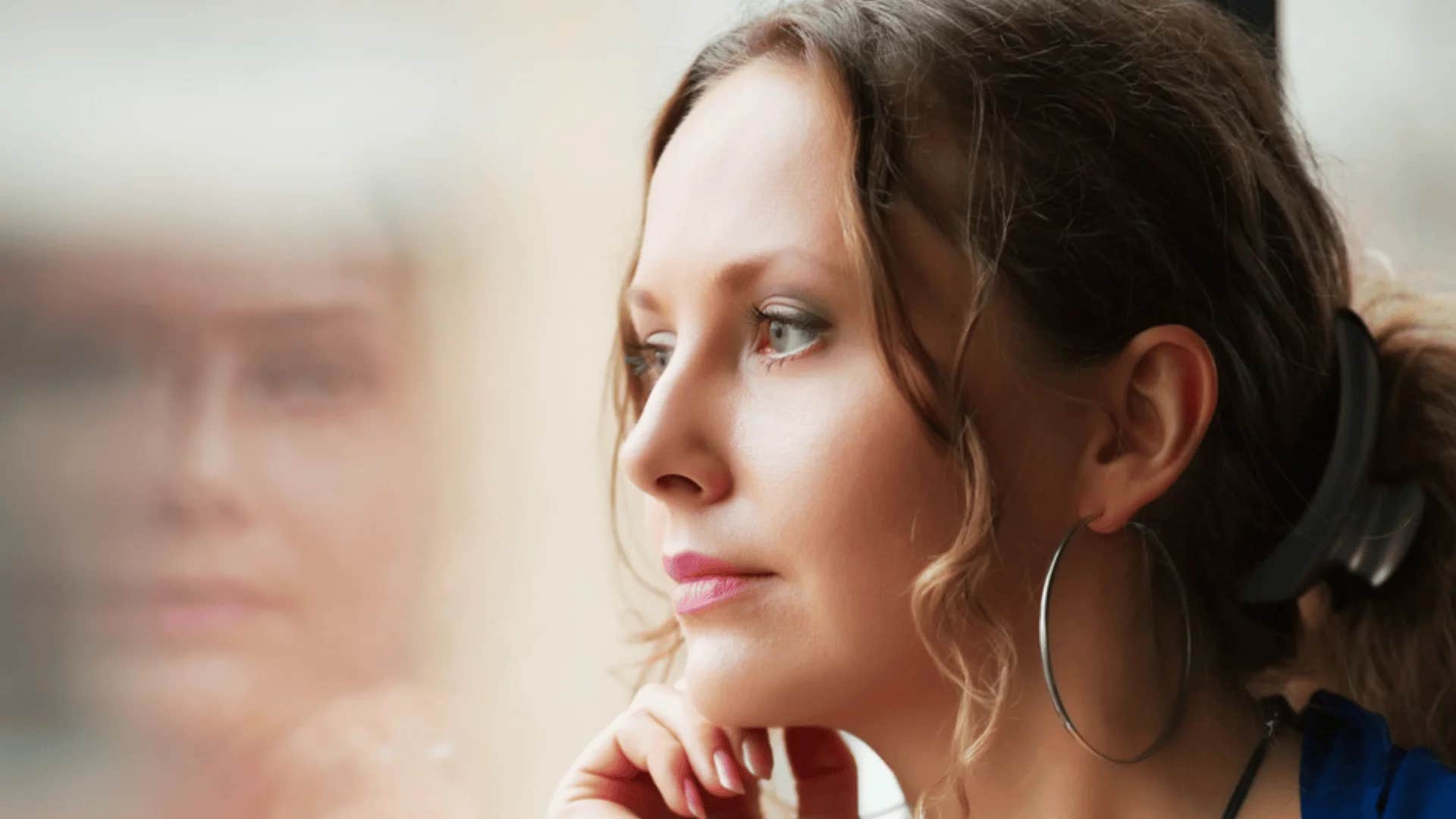 woman telling herself it's wasn't your fault