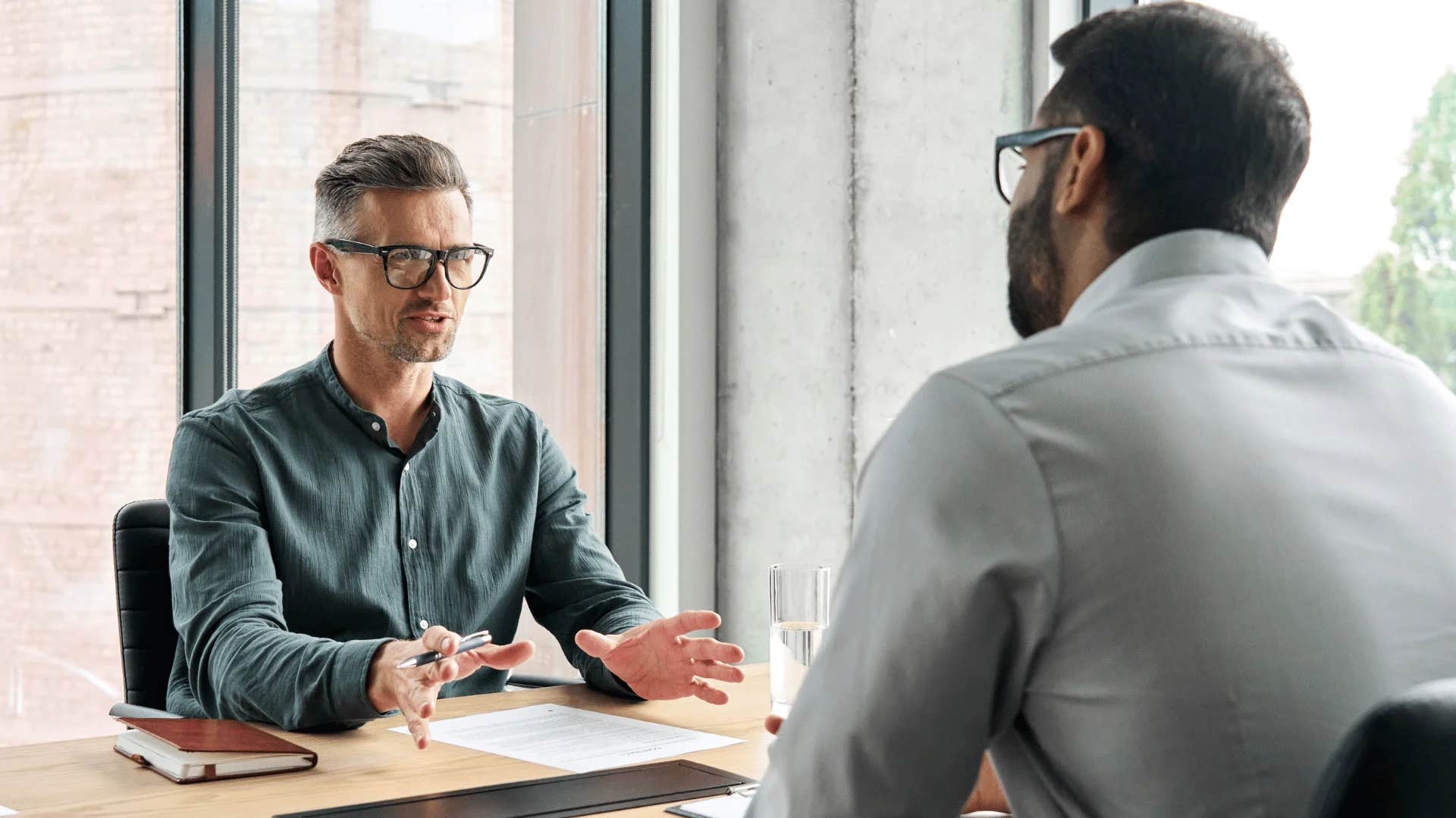 man telling colleague i hear you but i cannot do this