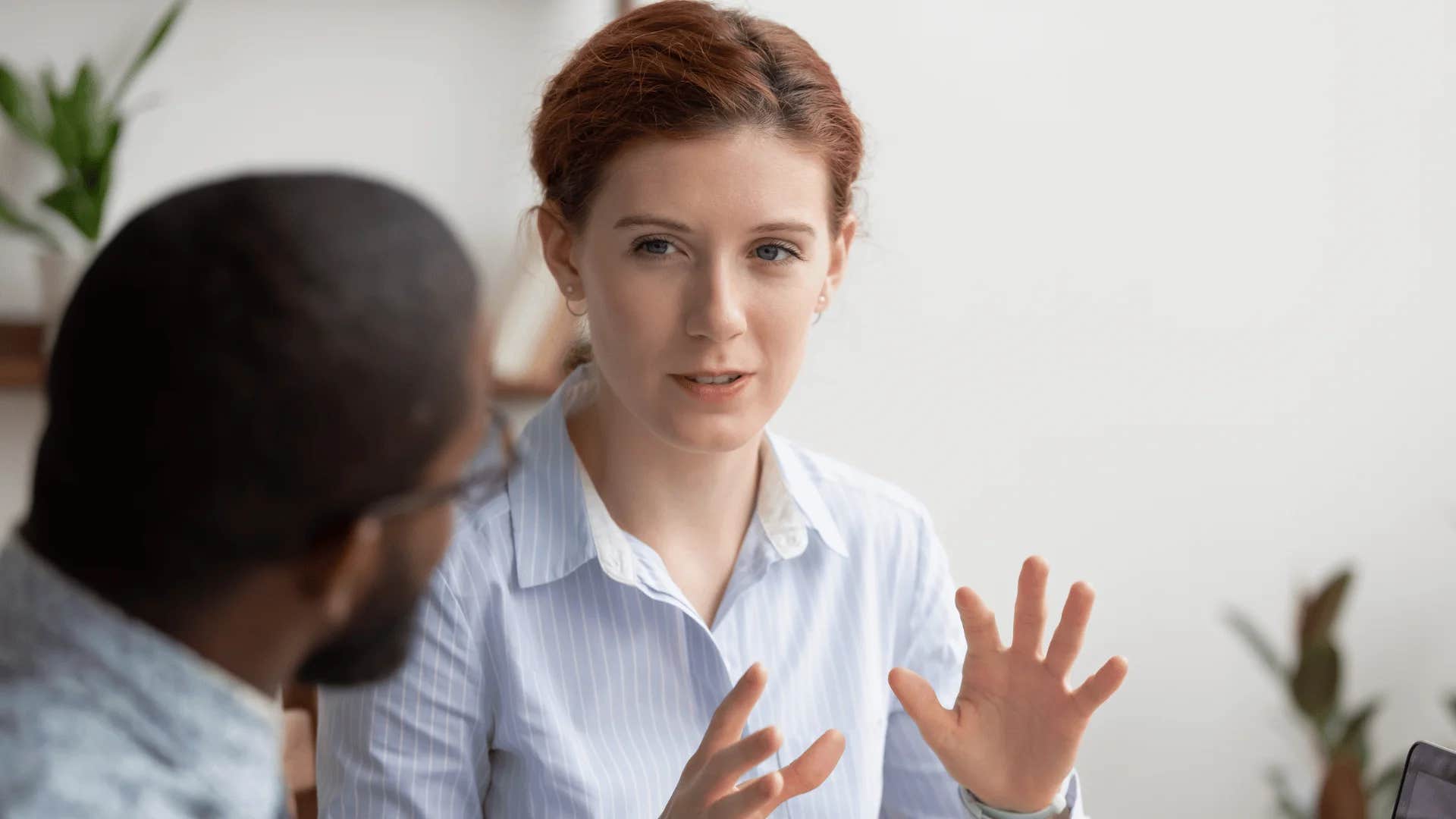 woman admitting to colleague i'm not the best person to handle that but i can point you in the right direction