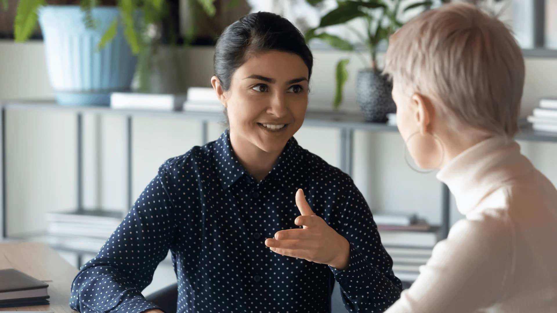 woman telling colleague i understand but unfortunately that falls outside of my normal responsibilities