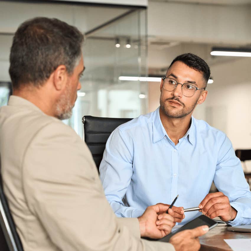 man telling colleague i'm not in a talking mood but i'm glad to be here with you