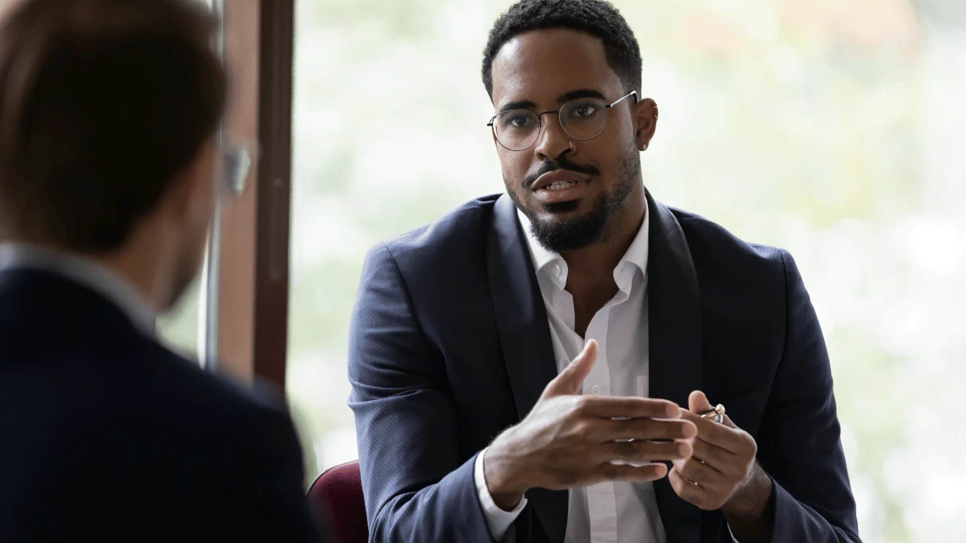 man telling colleague well you do the same thing