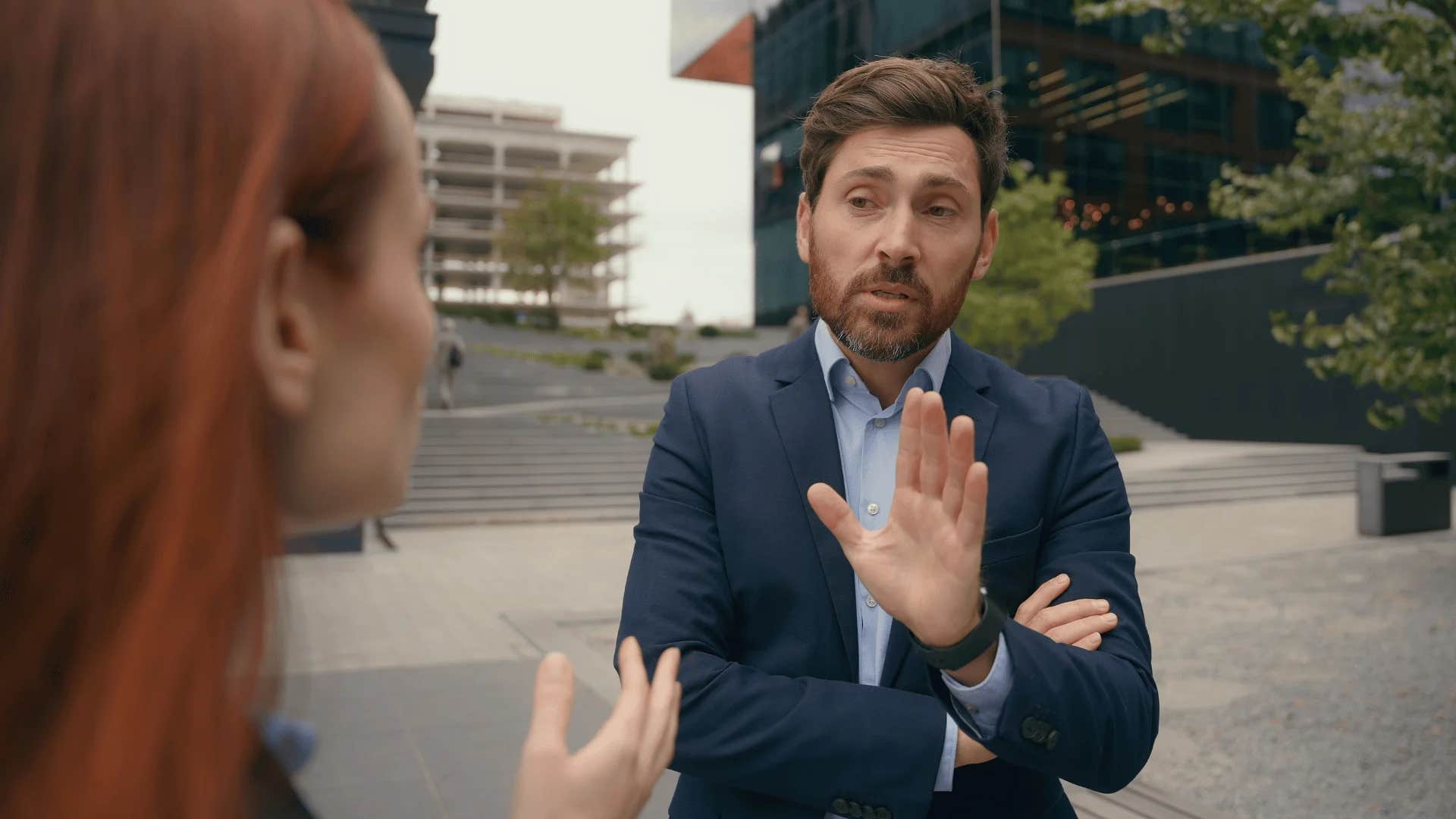 man telling woman that's not my job