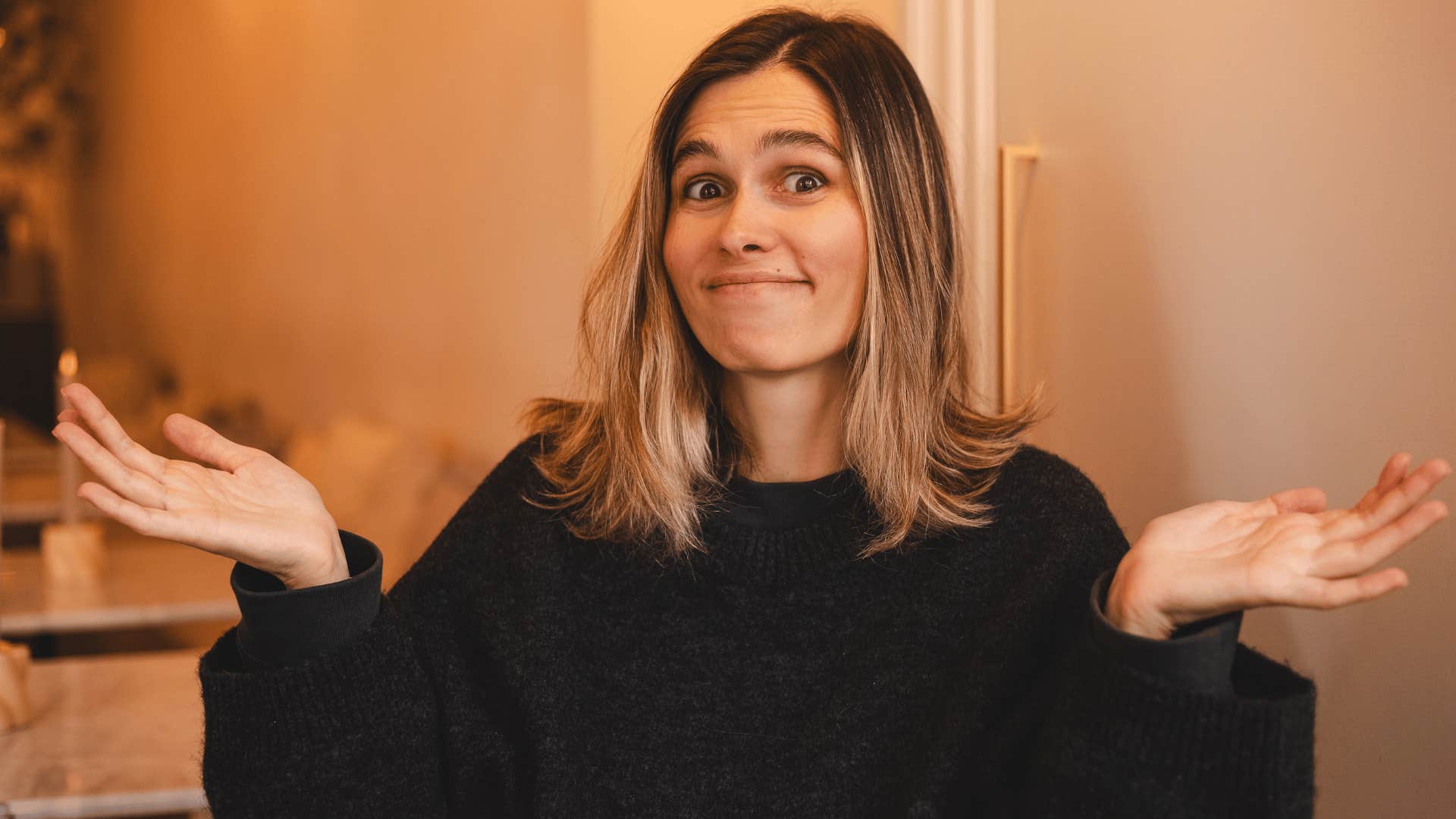 woman in black shirt shrugging as she says it is what it is