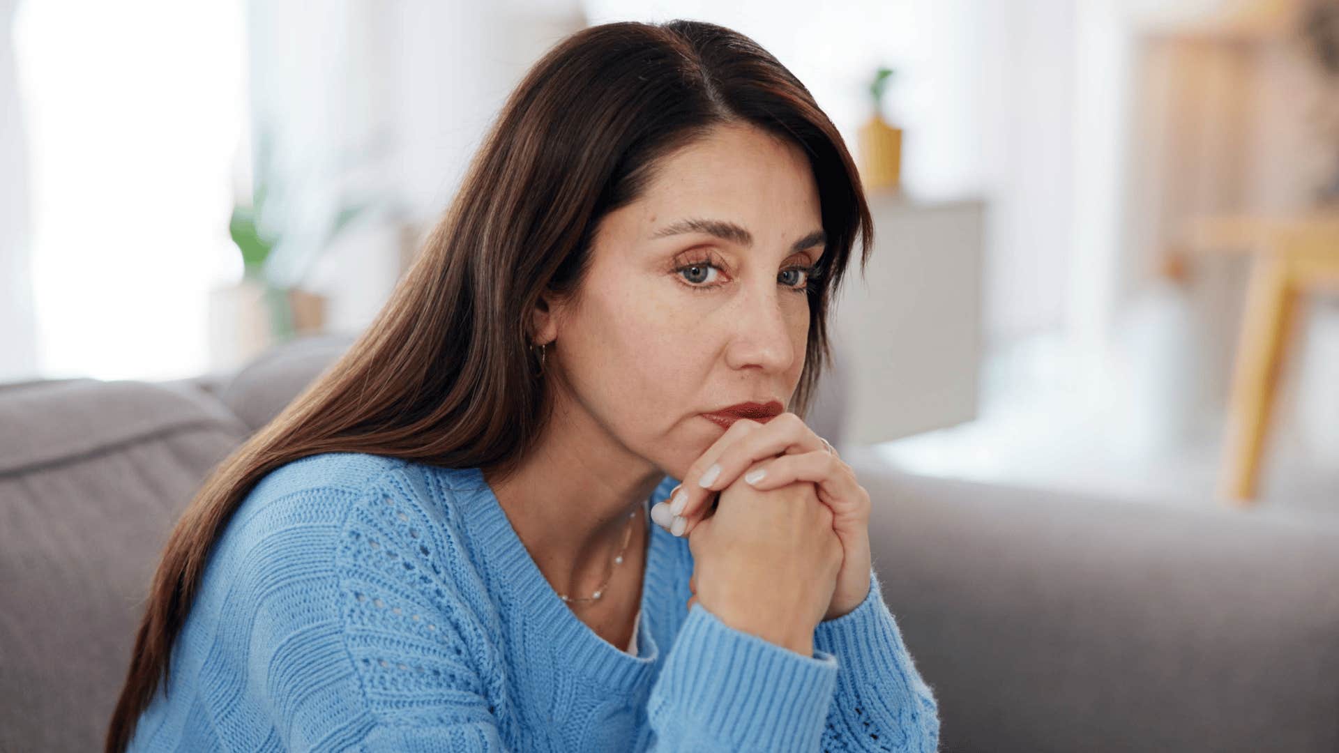 woman in blue shirt thinking to herself as she needs time to process this