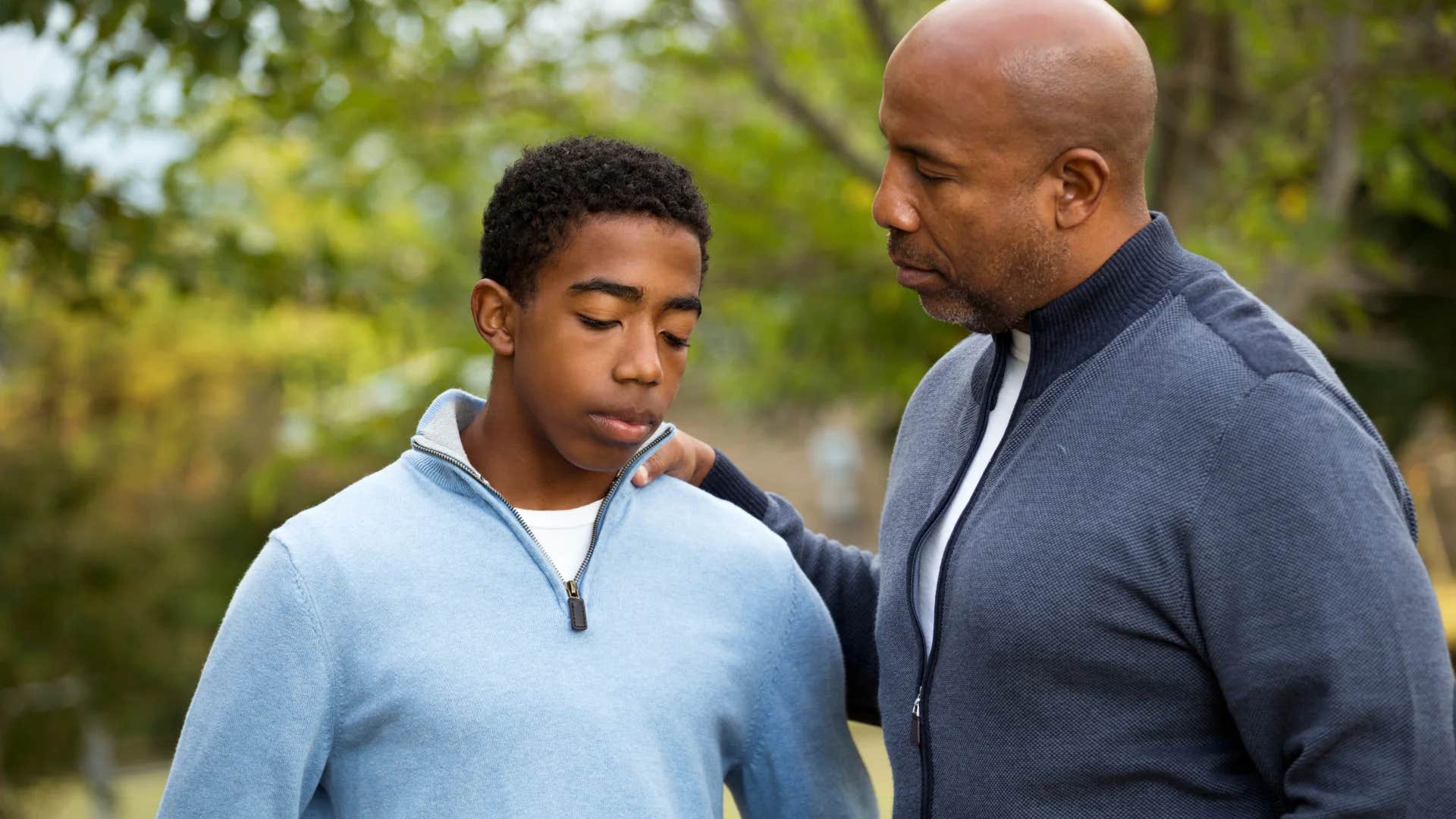 man telling teenage boy his problems aren't serious 