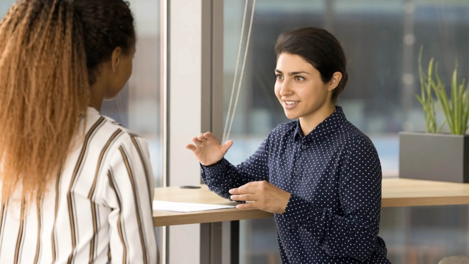 woman asking friend can you lower your voice