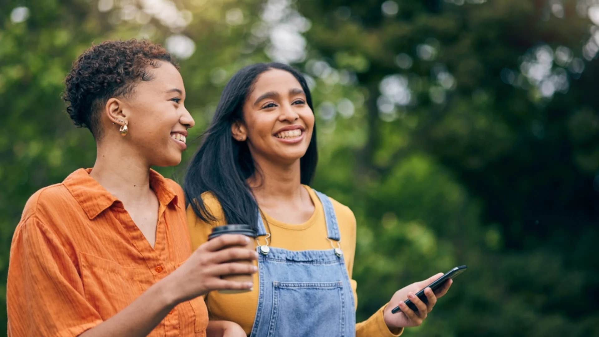 woman telling friend to hold that thought