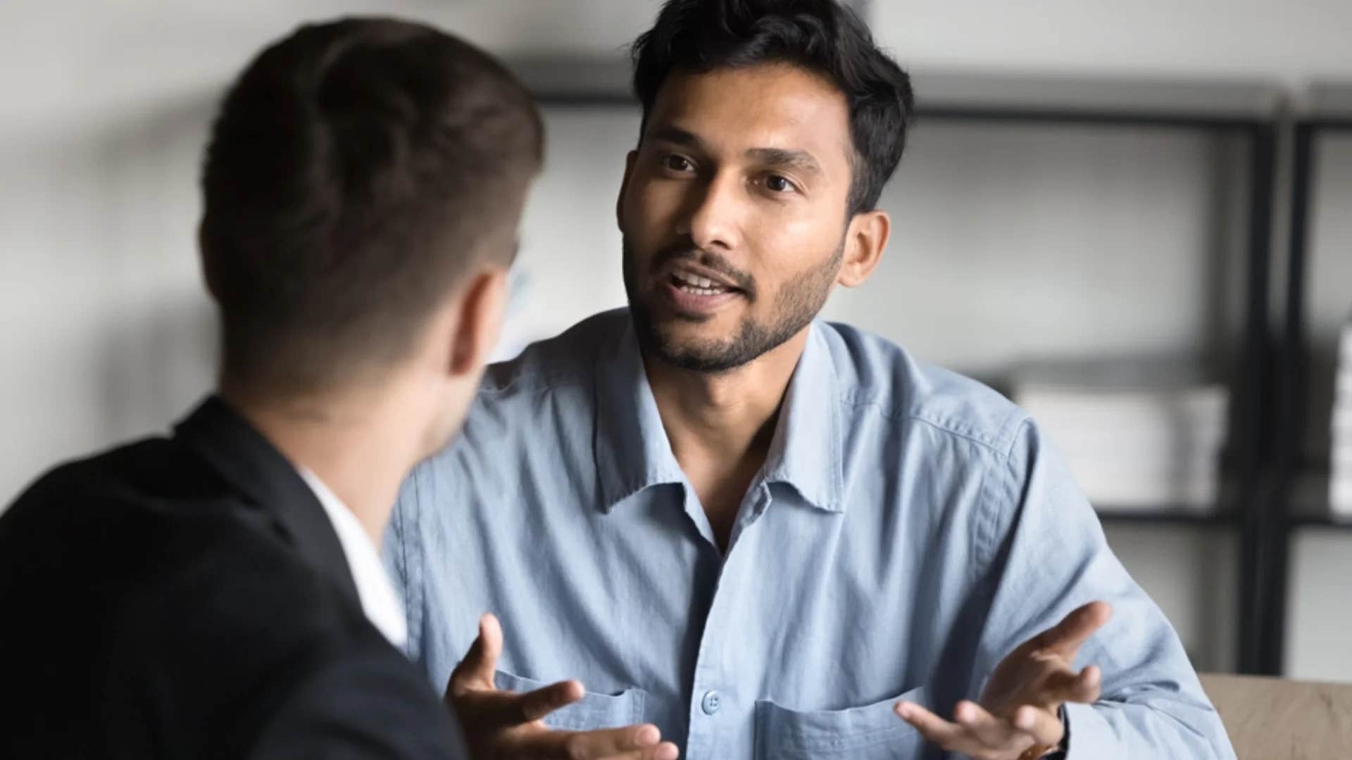 man telling colleague you seem committed to misunderstanding me