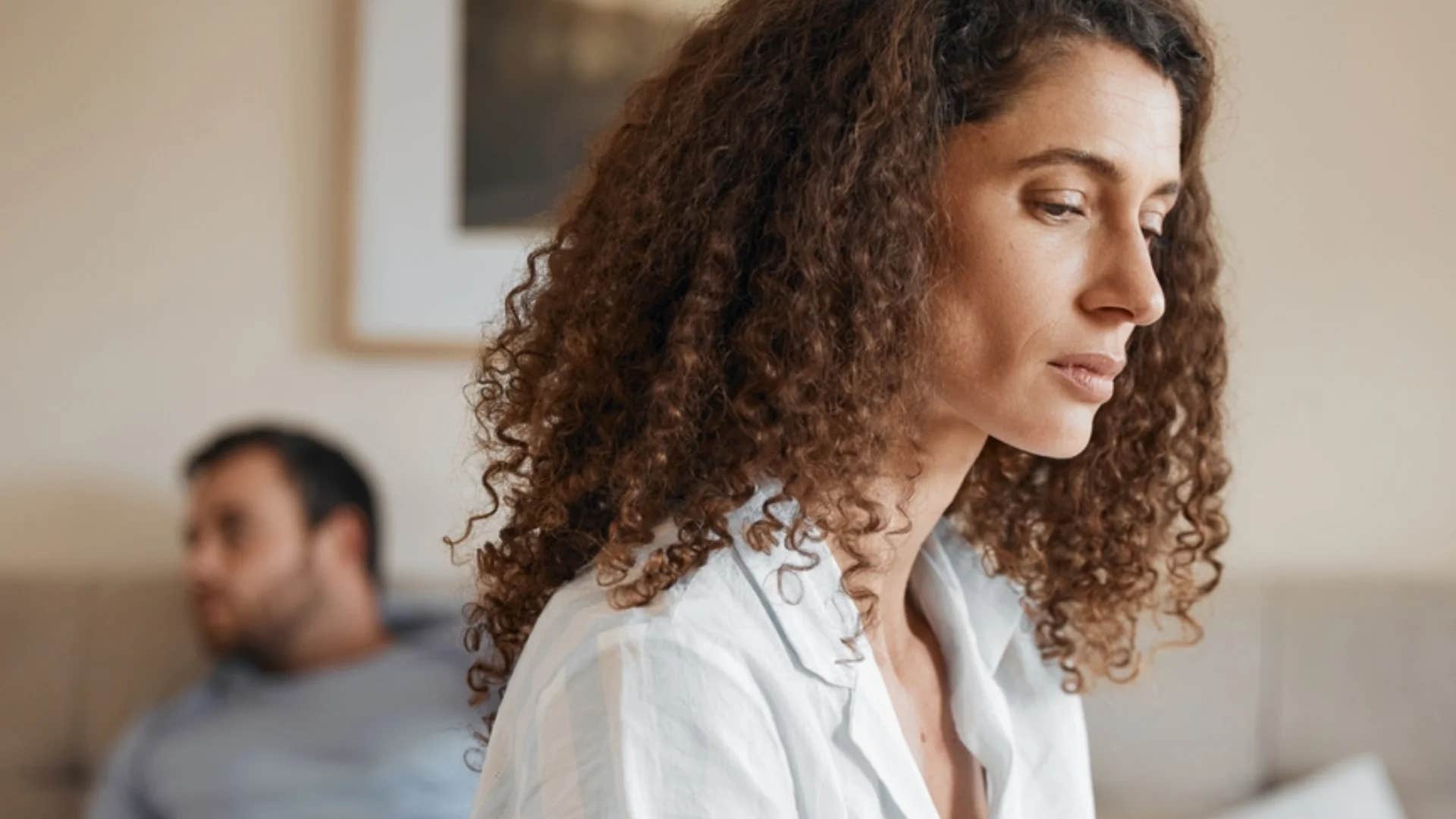 serious woman telling partner i've never felt so alone