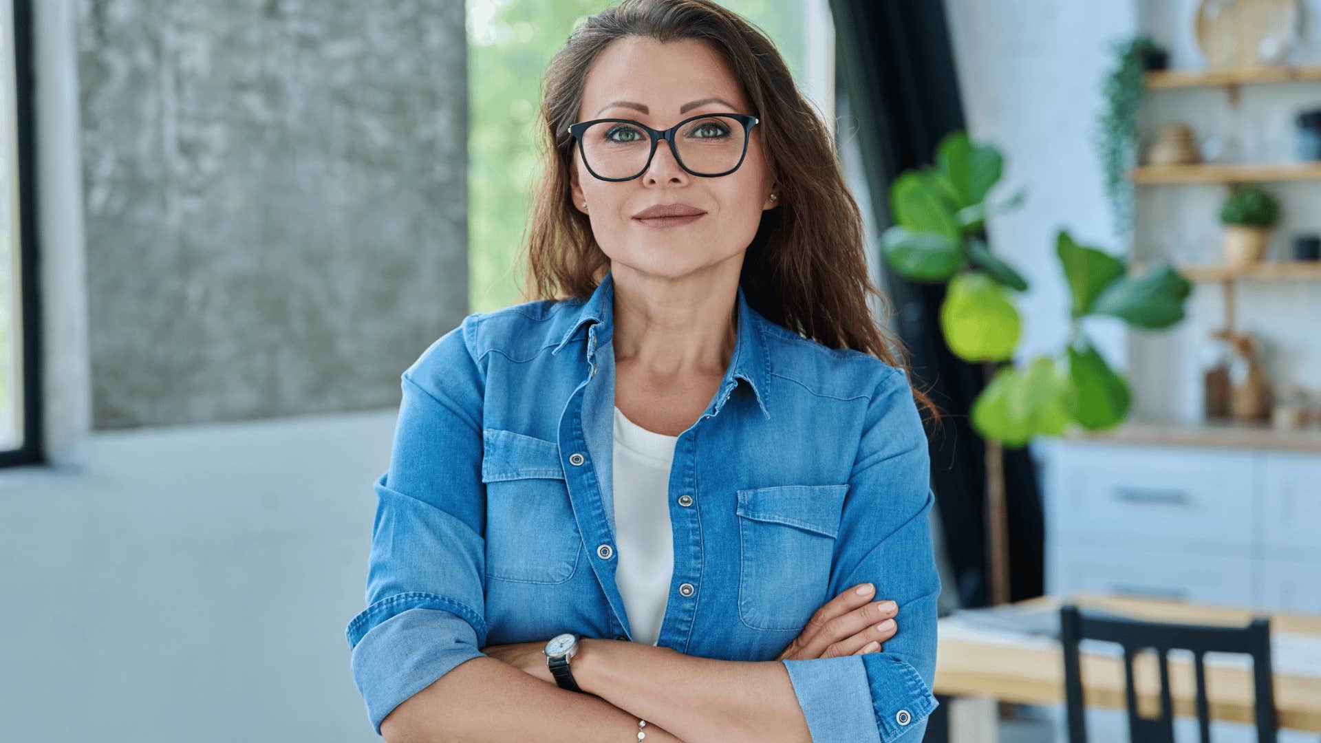 woman with white shirt and glasses crossing arms as she says i usually get what i want