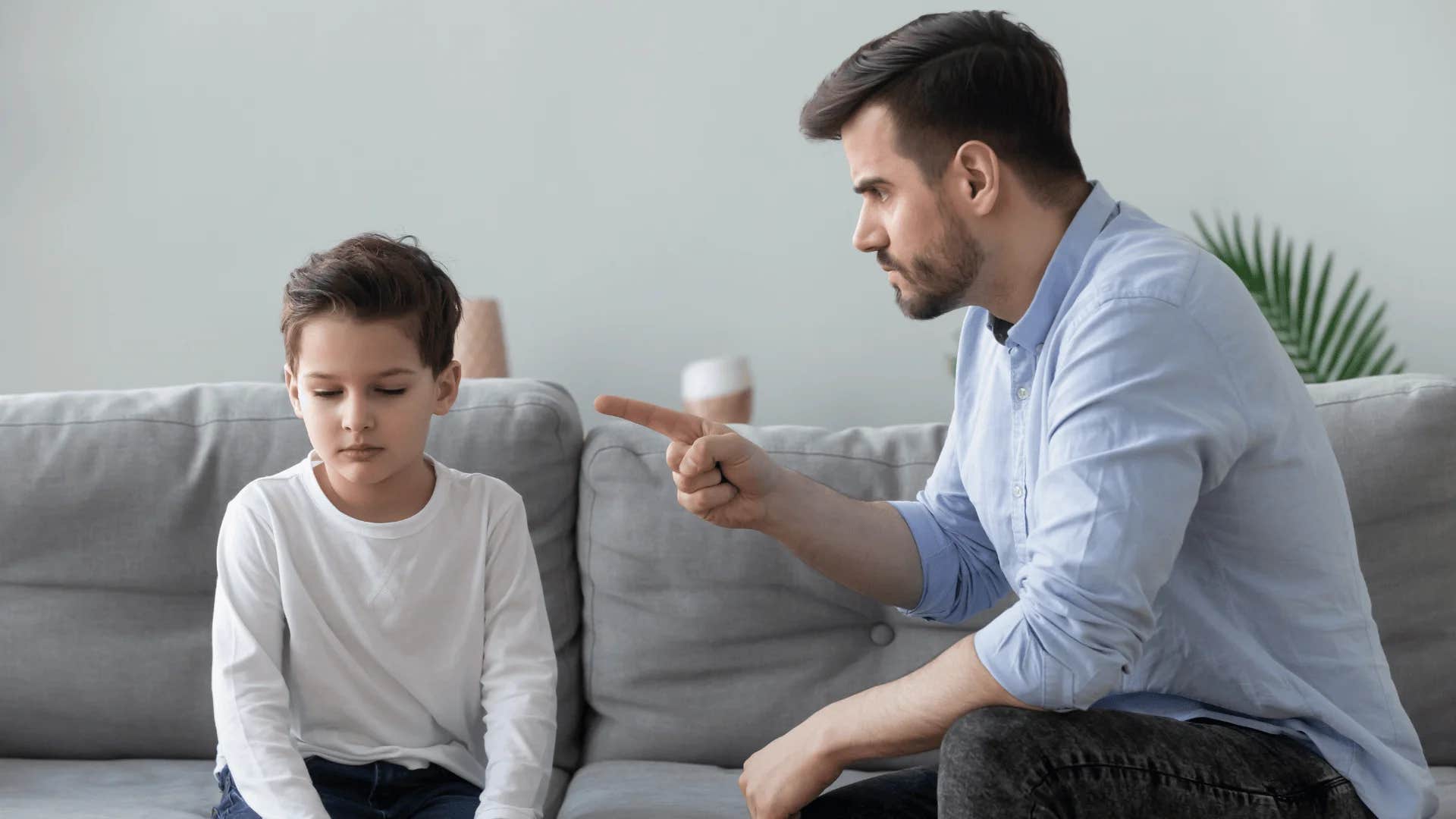 man yelling at young boy do as i say not as i do