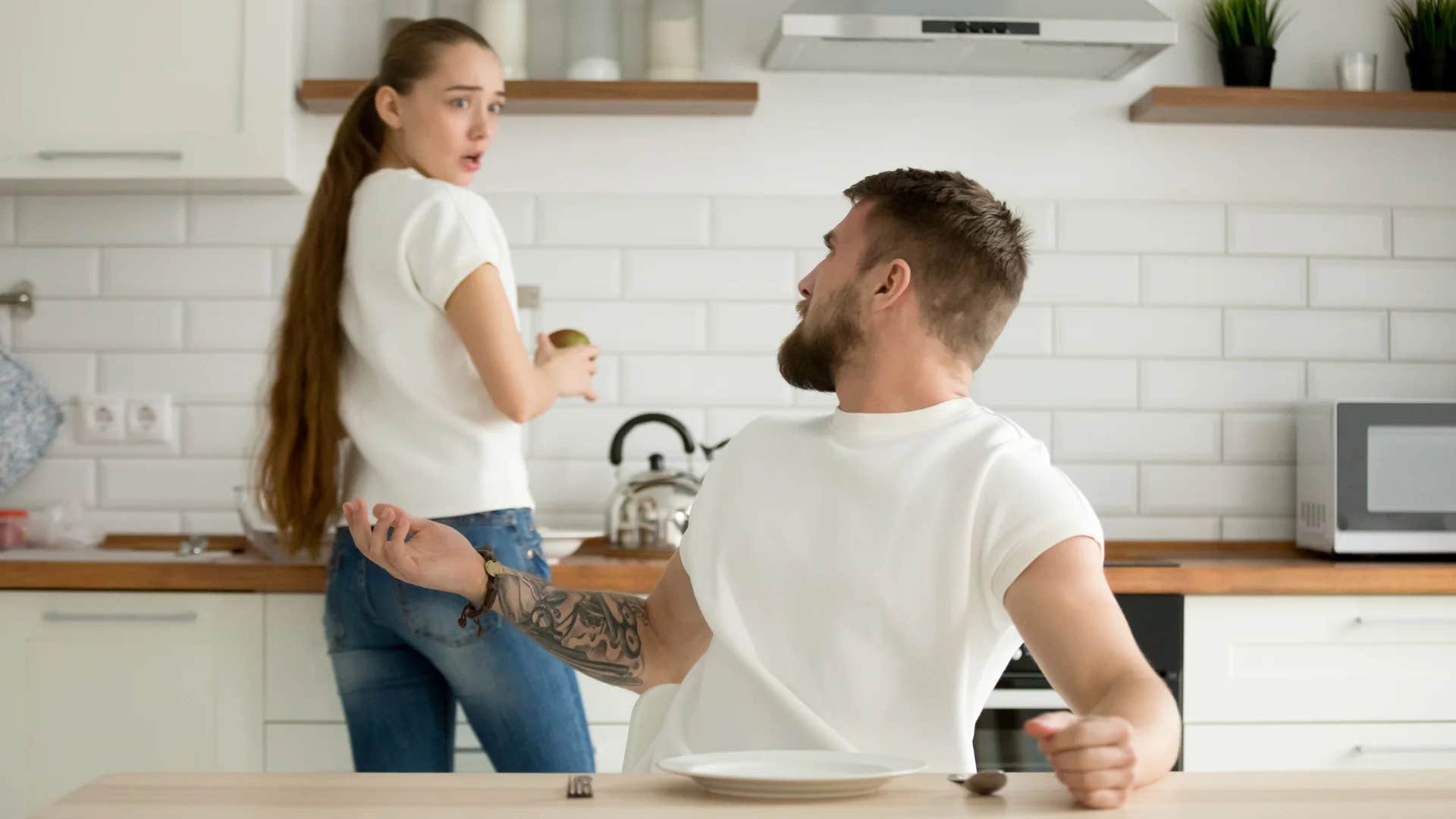 woman telling shocked man no offense