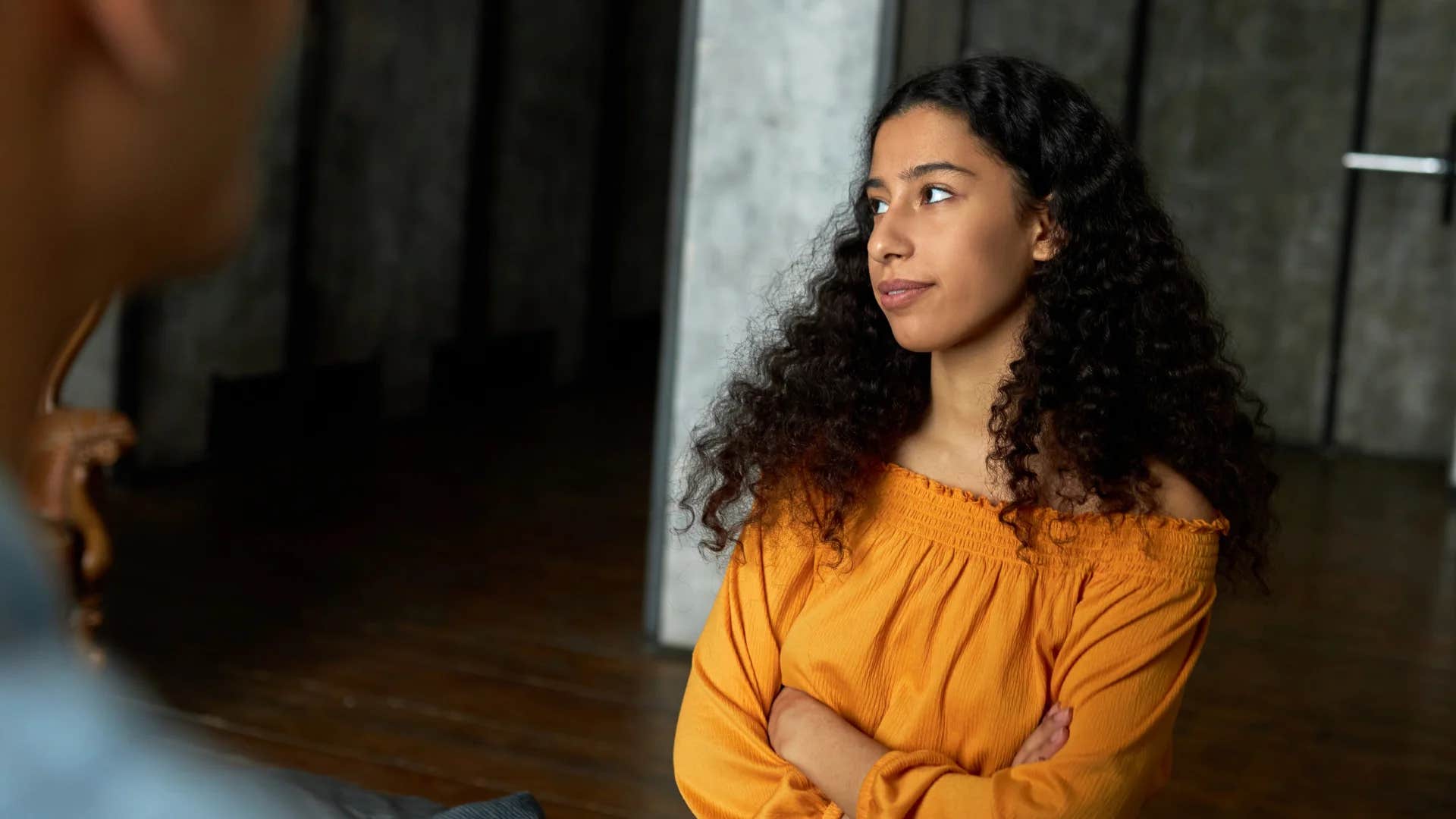 woman rolling her eyes saying it's fine really