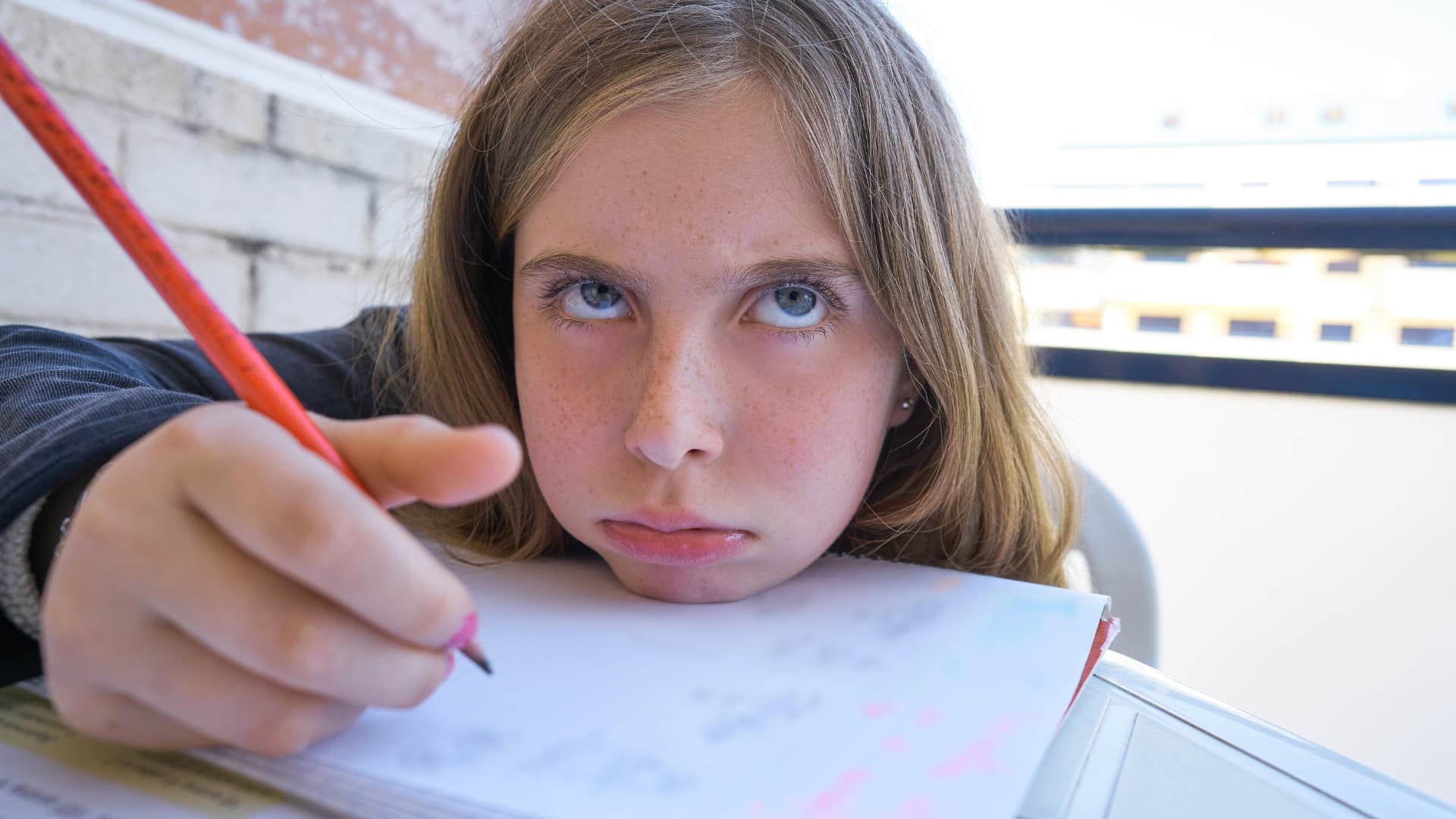 people raised in the 70s and 80s mastered embracing boredom bored little girl writing